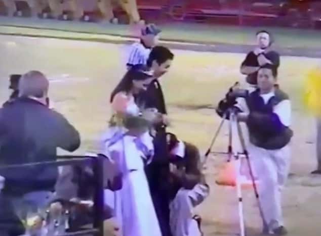 Meghan, as Prom Queen, stands with the Prom King at her high school