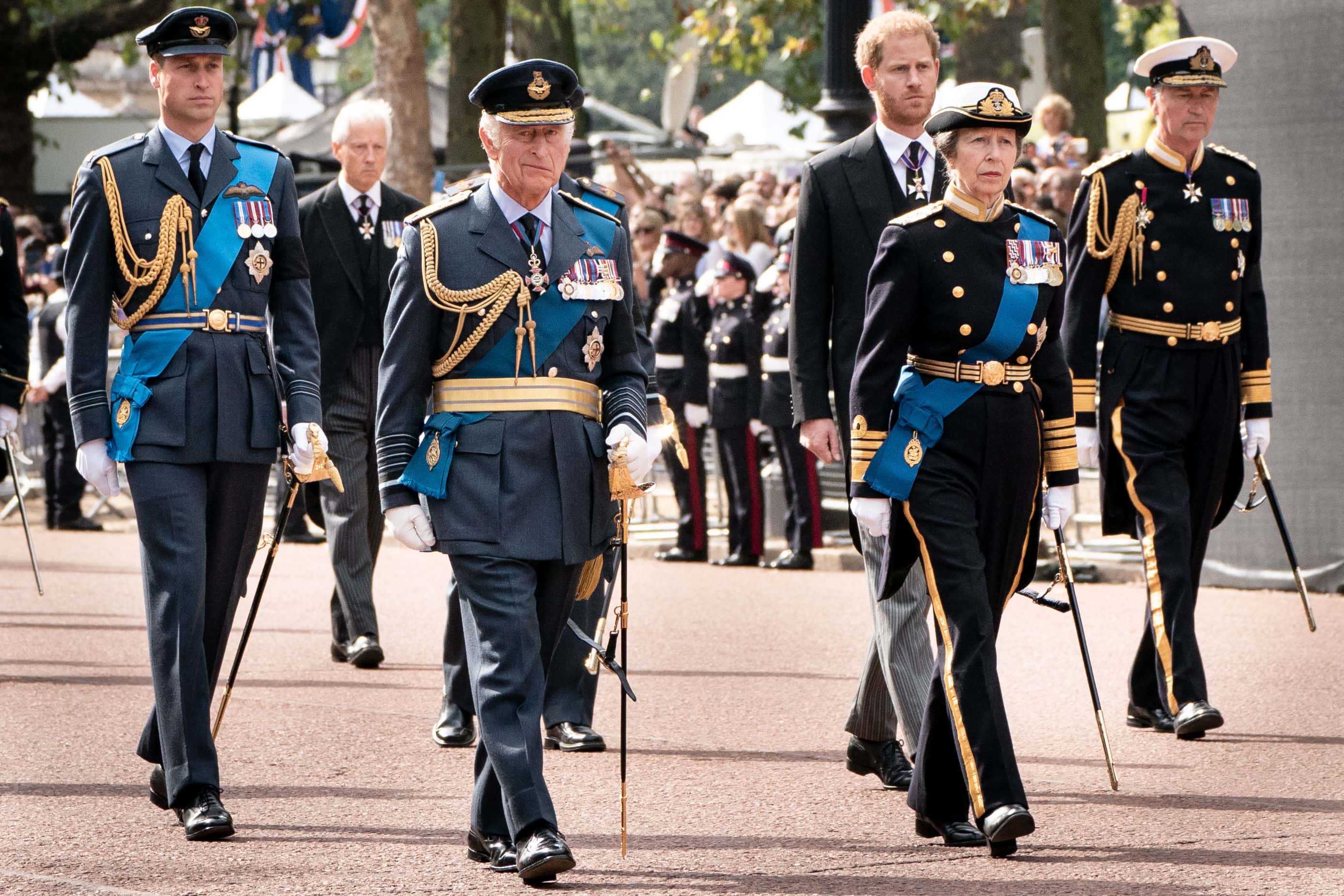 (L-R) Prince William, Prince of Wales, King Charles III, Princess Anne, Princess Royal, Prince Harry, Duke of Sussex and Sir Timothy Laurence follow the coffin of Queen Elizabeth II during a procession from Buckingham Palace to Westminster Hall during a ceremonial procession on September 14, 2022 in London, United Kingdom. (Photo by Stefan Rousseau - WPA Pool/Getty Images)
