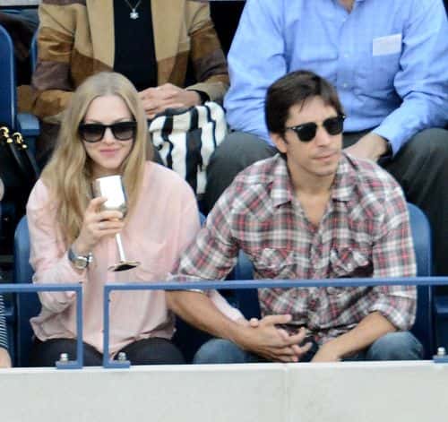 Actress Amanda Seyfried (L) and Justin Long attend The Moet & Chandon Suite at USTA Billie Jean King National Tennis Center on September 9, 2013 in New York City.