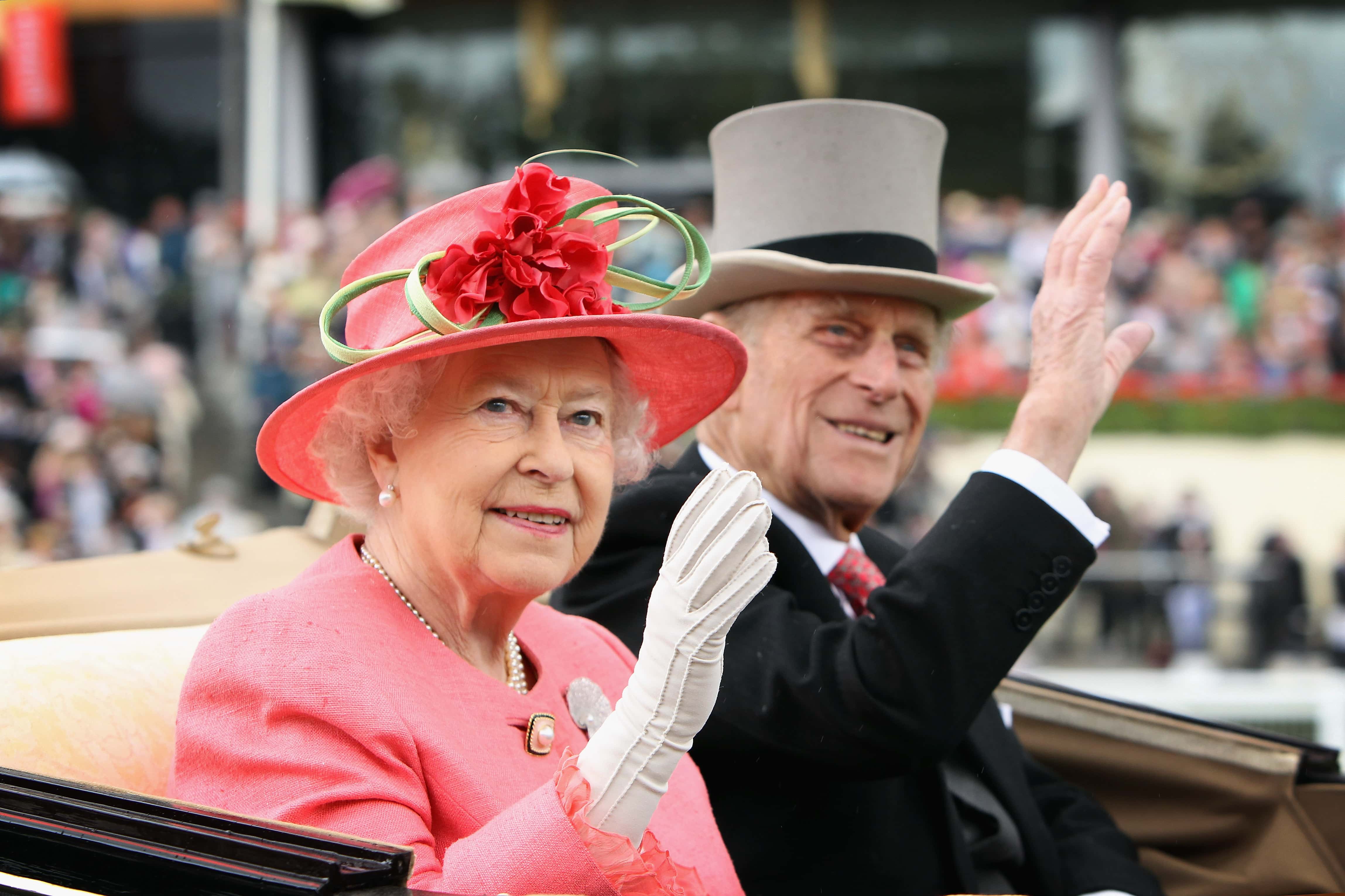 Queen Elizabeth ll and Prince Philip, Duke of Edinburgh arrive in an open carriage on Ladies Day at Royal Ascot on June 16, 2011 in Ascot, England. The five-day meeting is one of the highlights of the horse racing calendar, with 2011 marking the 300th anniversary of the annual event. Horse racing has been held at the famous Berkshire course since 1711.