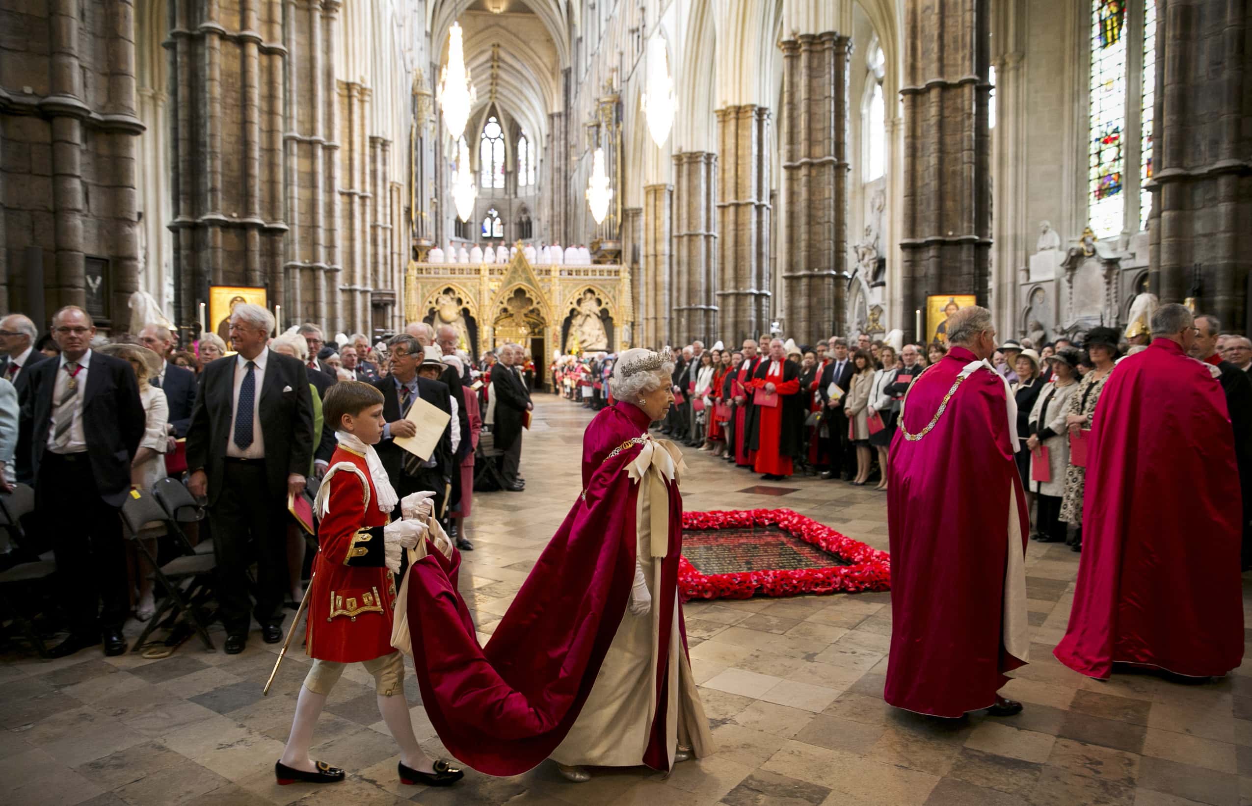 Queen Elizabeth II (2L) arrives at Westminster Abbey with Prince Charles, Prince of Wales (2R) to attend the Order of the Bath Service as Page of Honour Hugo Bertie (L) carries her robes on May 9, 2014  in London, England. The Order of the Bath is comprised largely of people with distinguished military careers and dates back to 1725 and uses Henry VII's Chapel in Westminster Abbey as its Chapel. The Queen is Sovereign Head of the Order of the Bath and Prince Charles is it's Great Master.