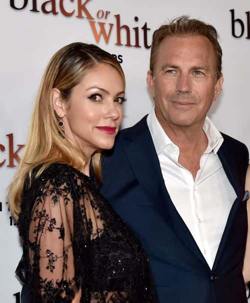 Actor Kevin Costner (R) and his wife Christine Baumgartner arrive at the premiere of Relativity Media's 