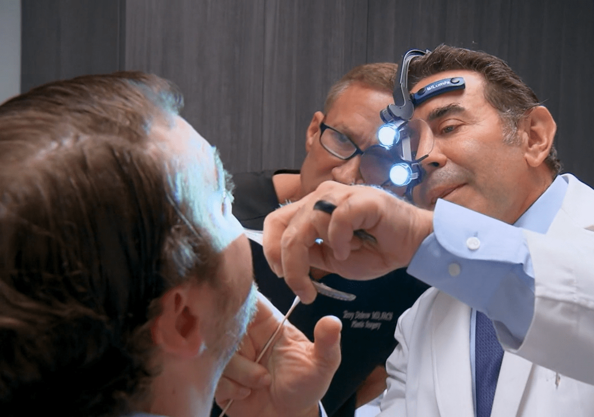 Dr Paul Nassif examining Nate Gomes on 'Botched' Season 8 (E!Entertainment)