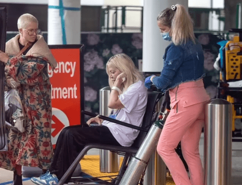 The actress donned a baggy white T-shirt with an image from the movie Breakfast Club on it, black sweatpants, and white and blue Nike sneakers 