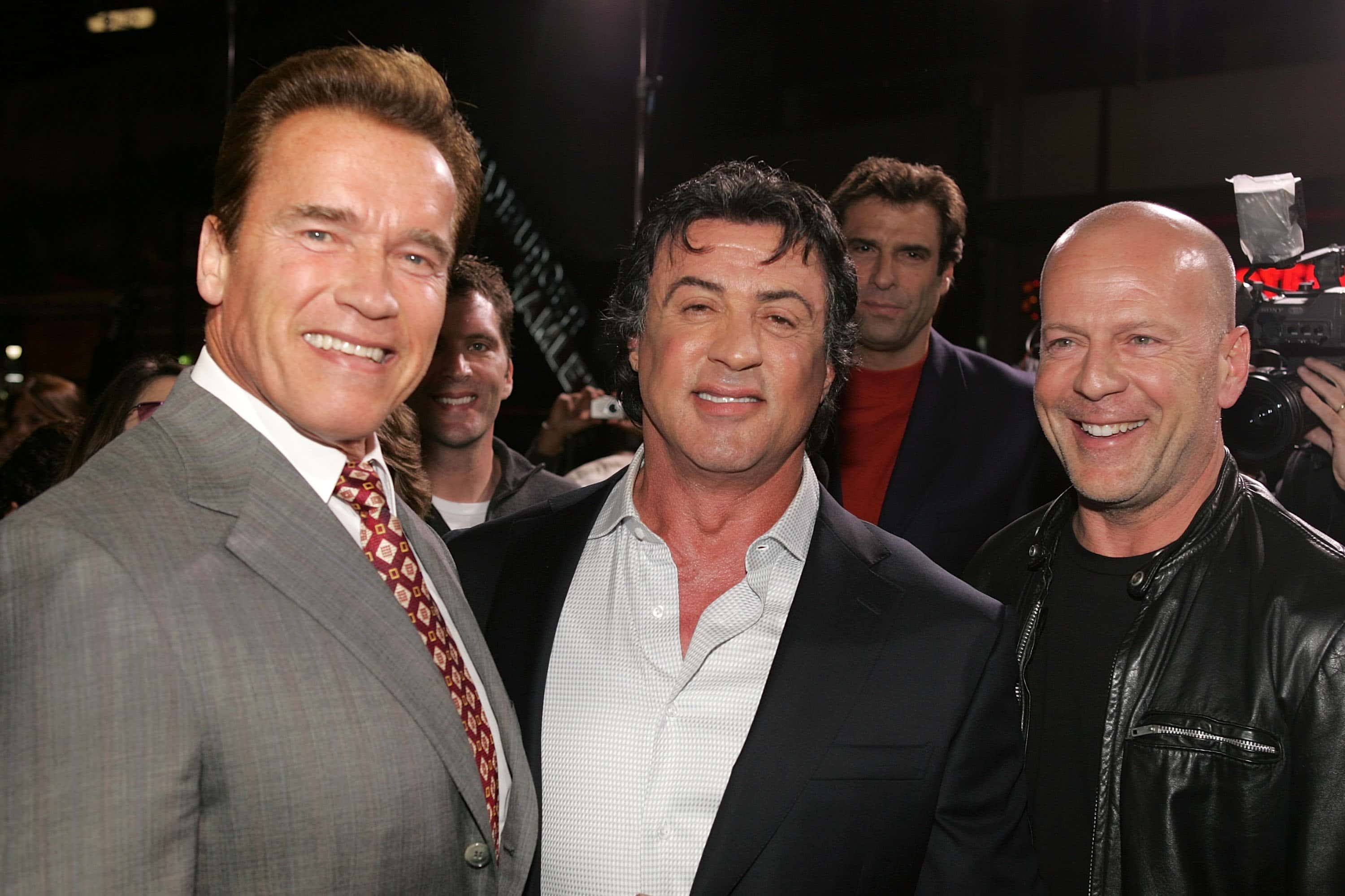California governor Arnold Schwarzenegger, actor Sylvester Stallone and actor Bruce Willis arrive at the premiere of MGM's 