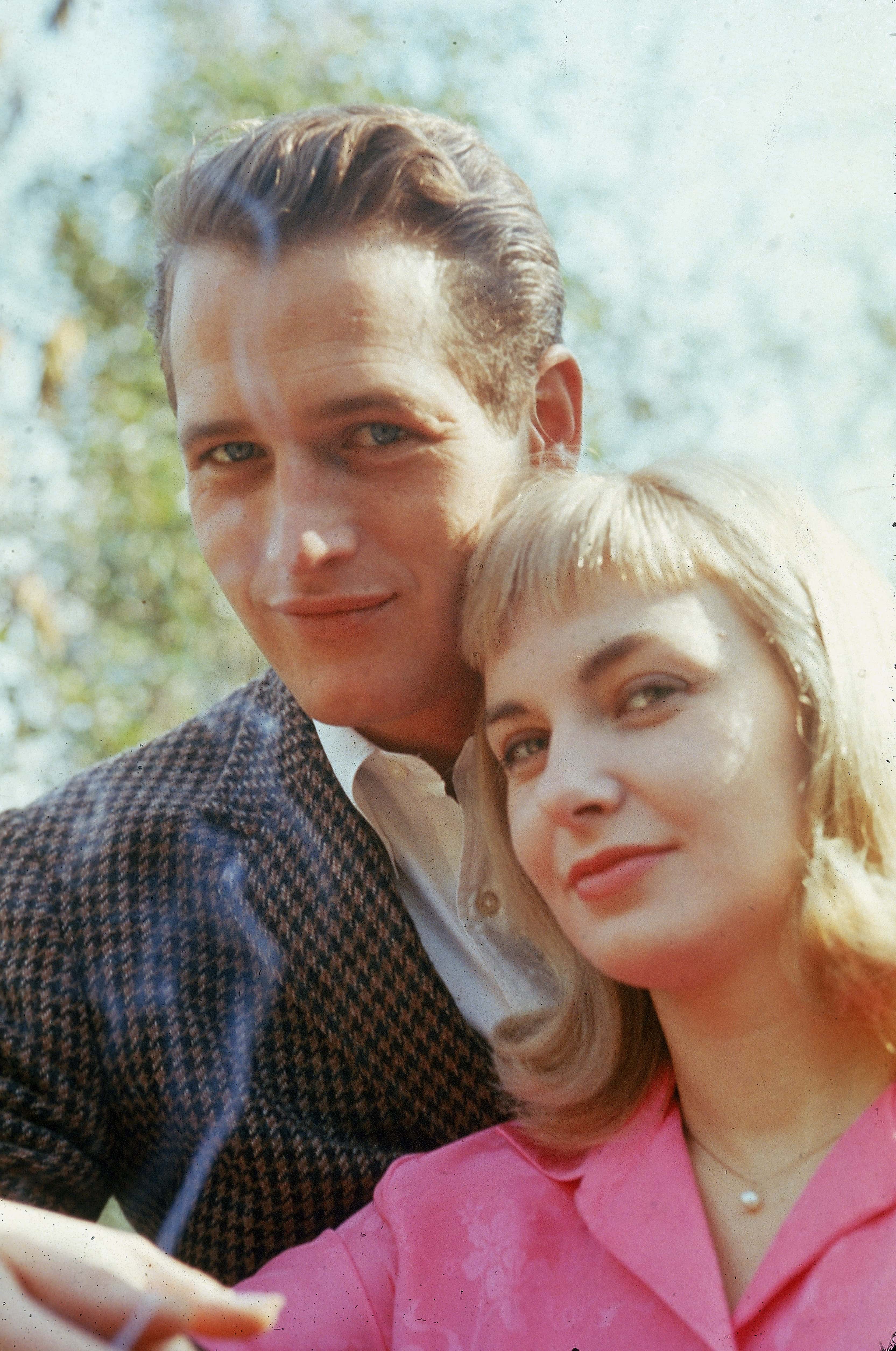 Portrait of married American actors Paul Newman and Joanne Woodward standing outdoors, circa 1962. (Photo by Hulton Archive/Getty Images)