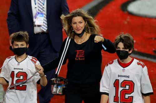 Gisele Bundchen, wife of Tom Brady #12 of the Tampa Bay Buccaneers, celebrates with Benjamin Brady and John Moynahan after the Buccaneers defeated the Kansas City Chiefs 31-9 in Super Bowl LV at Raymond James Stadium on February 07, 2021 in Tampa, Florida.