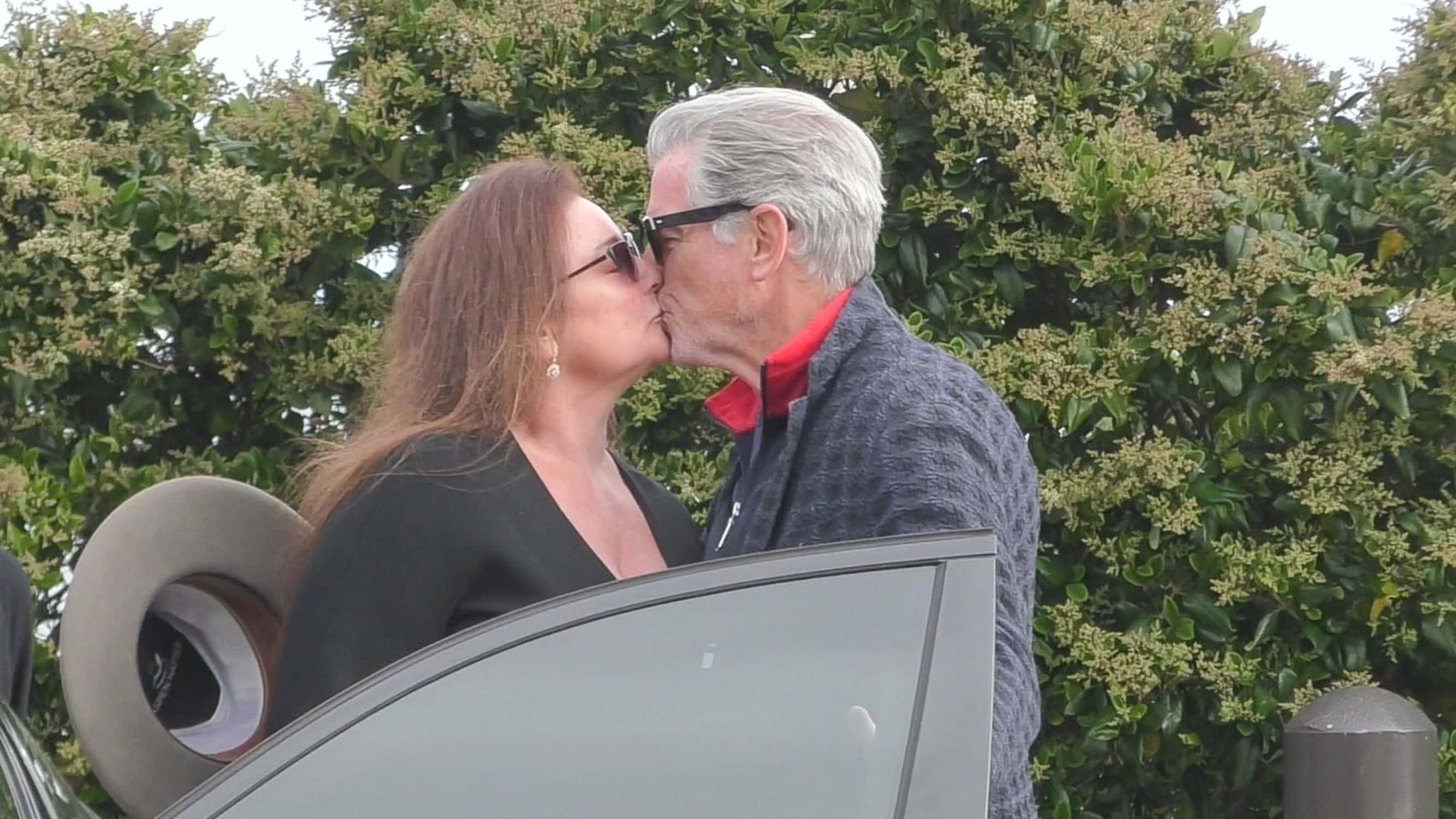 Pierce Brosnan kissed Keely Shaye Smith during birthday outing (Backgrid)
