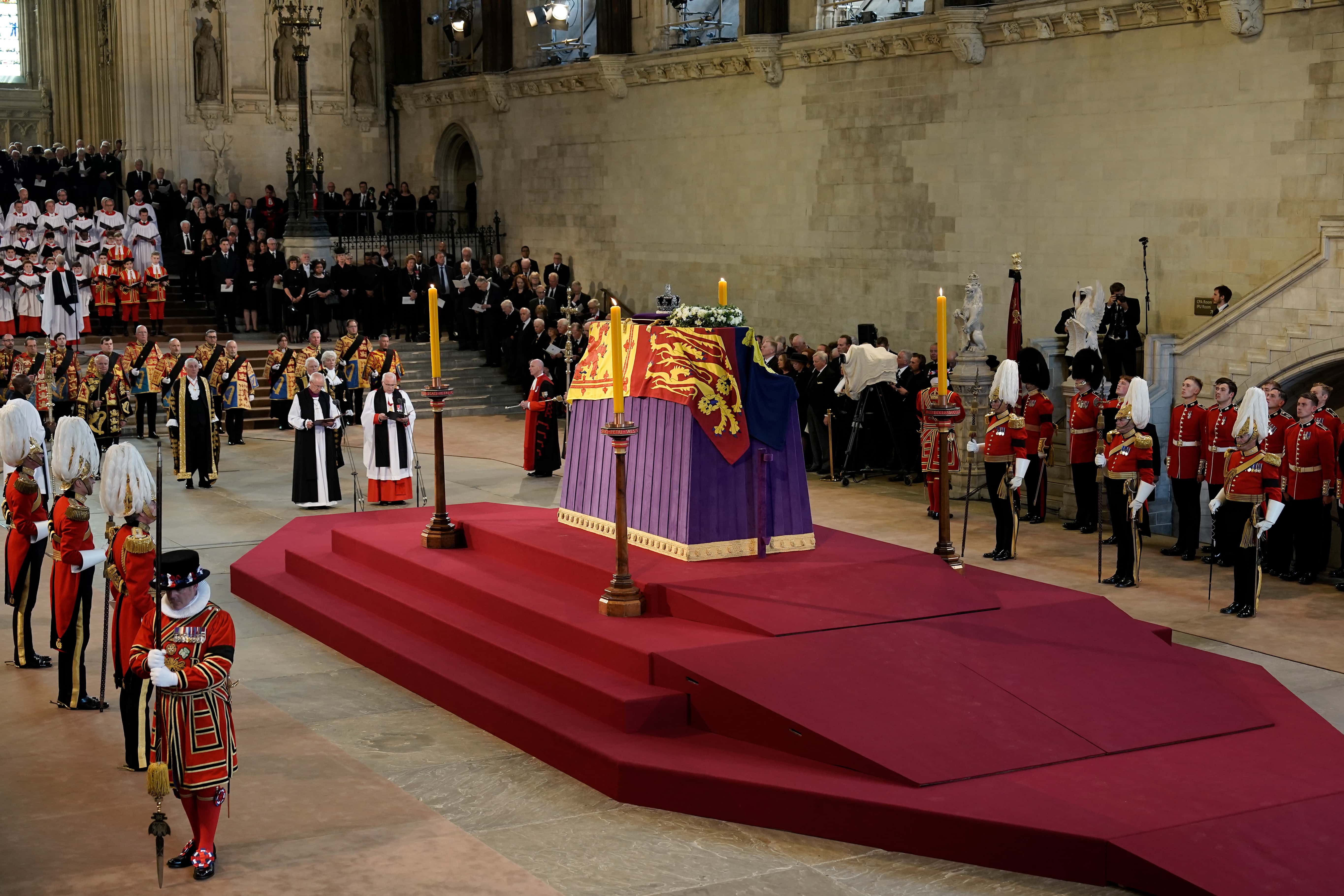 A general view as the coffin carrying Queen Elizabeth II rests in Westminster Hall for the Lying-in State on September 14, 2022 in London, England. Queen Elizabeth II's coffin is taken in procession on a Gun Carriage of The King's Troop Royal Horse Artillery from Buckingham Palace to Westminster Hall where she will lay in state until the early morning of her funeral. Queen Elizabeth II died at Balmoral Castle in Scotland on September 8, 2022, and is succeeded by her eldest son, King Charles III.