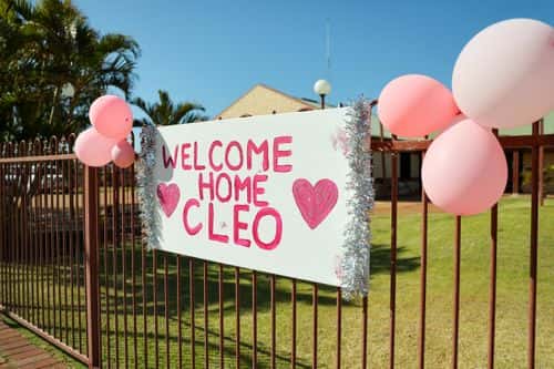 A sign is seen on a fence in celebration of the finding of Cleo Smith on November 4, 2021 in Carnarvon, Australia. Cleo Smith was found in the early hours Wednesday 3 November after police raided a house in Carnarvon. The four-year-old went missing from the tent she was sharing with her family at the Blowholes campsite near Carnarvon on 16 October. A 36-year-old man is now in custody.