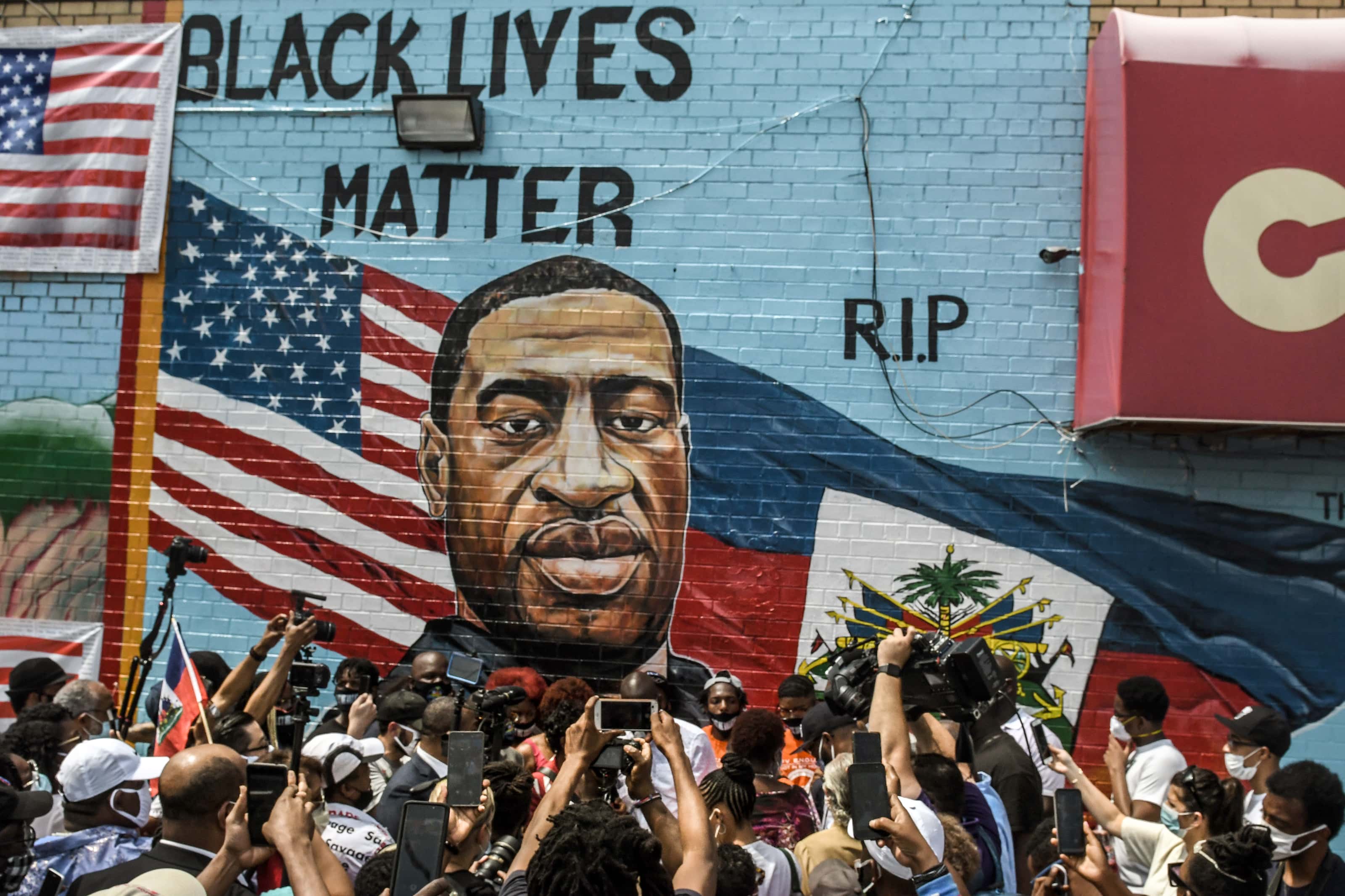 NEW YORK, NY - JULY 13: A mural painted by artist Kenny Altidor depicting George Floyd is unveiled o