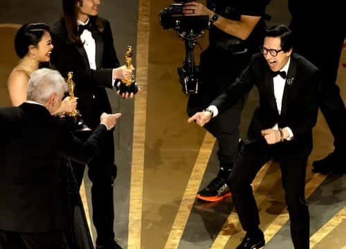 Ke Huy Quan (R) accepts the award for Best Picture for