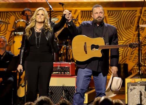 In this image released on December 21,  (L-R) Trisha Yearwood and Garth Brooks perform onstage during Homeward Bound: A GRAMMY Salute To The Songs Of Paul Simon at Hollywood Pantages Theatre on April 06, 2022 in Hollywood, California.