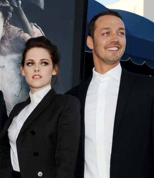 Actress Kristen Stewart (L) and director Rupert Sanders arrive at a screening of Universal Pictures' 