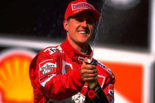 11 Apr 1999:  Michael Schumacher of the Ferrari team celebrates coming in second place during the 1999 Brazilian Grand Prix held at the Interlagos Circuit in Sao Paulo, Brazil.  Mika Hakkinen and the McLaren-Mercedes car went on to win the Grand Prix.\ Mandatory Credit: Mark Thompson /Allsport