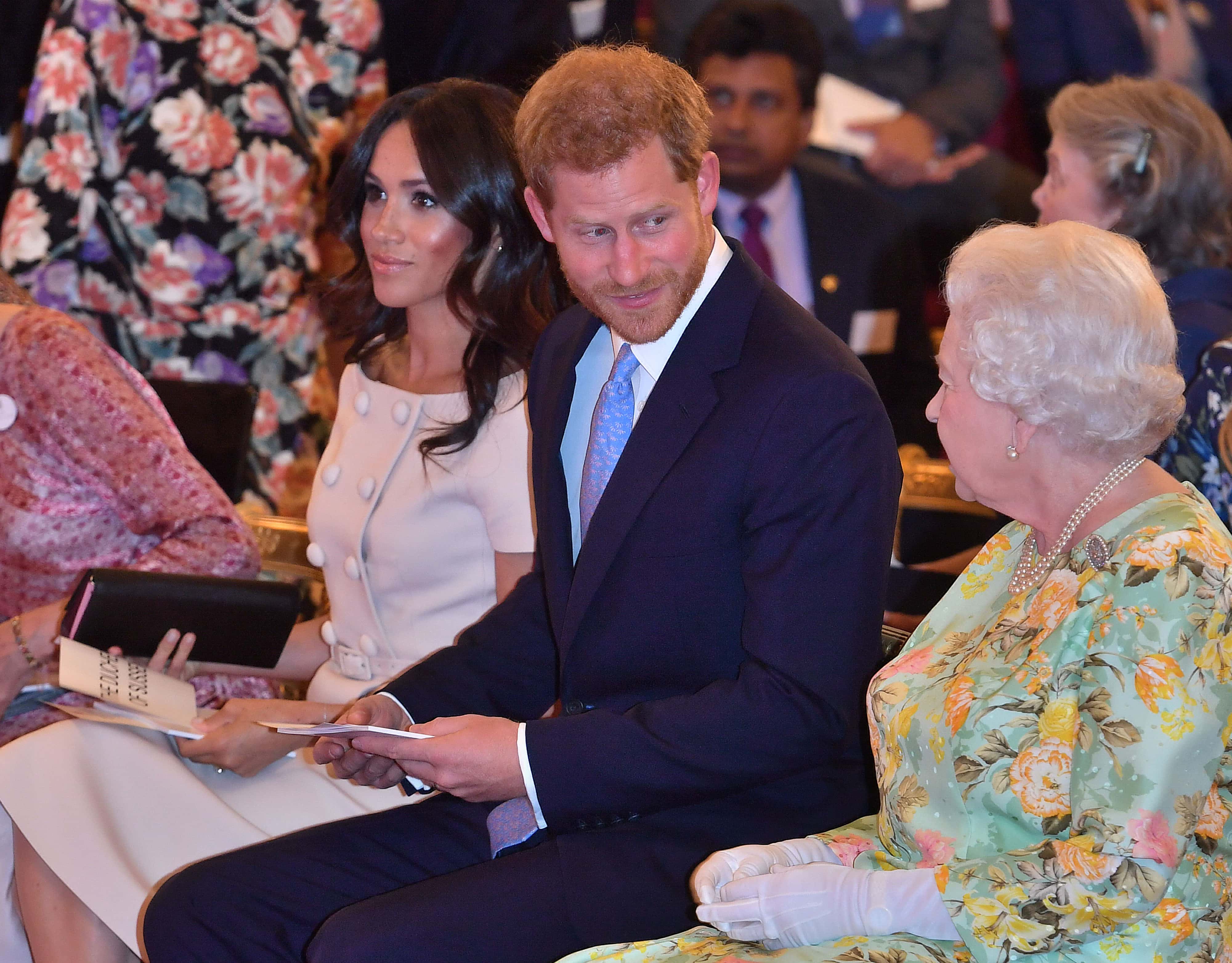 Queen Elizabeth II with Prince Harry, Duke of Sussex and Meghan, Duchess of Sussex at the Queen's Young Leaders Awards Ceremony at Buckingham Palace on June 26, 2018 in London, England. The Queen's Young Leaders Programme, now in its fourth and final year, celebrates the achievements of young people from across the Commonwealth working to improve the lives of people across a diverse range of issues including supporting people living with mental health problems, access to education, promoting gender equality, food scarcity and climate change.