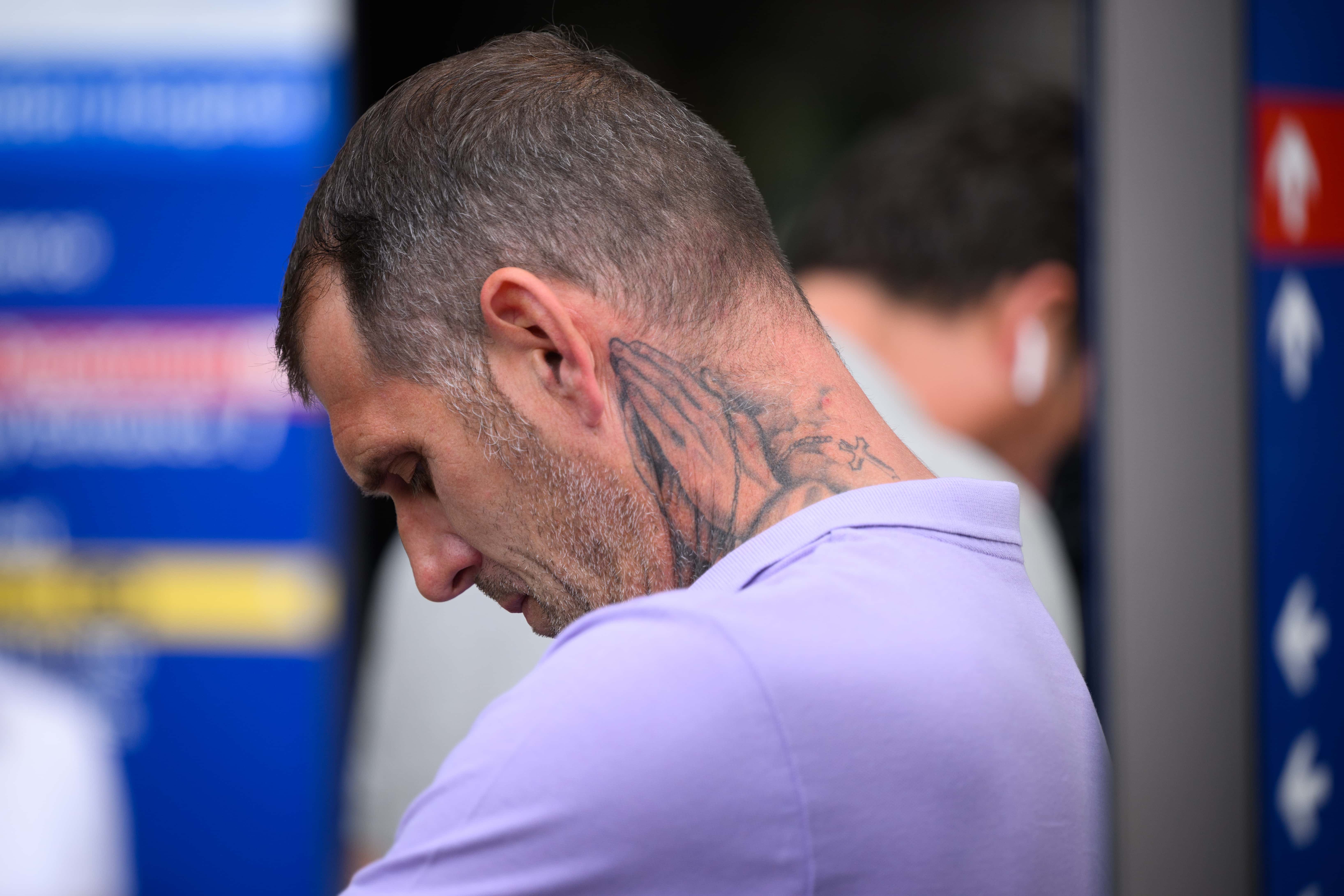 A family friend listens as Ella Carter, the sister-in-law of Archie Batterbee, is interviewed by media outside the Royal London Hospital on August 02, 2022 in London, England. Hollie Dance and Paul Battersbee, the parents of Archie Battersbee, 12, have been fighting against the Doctors treating their son who have concluded that he is brain-stem dead and that continued life-support treatment is not in his best interests.
