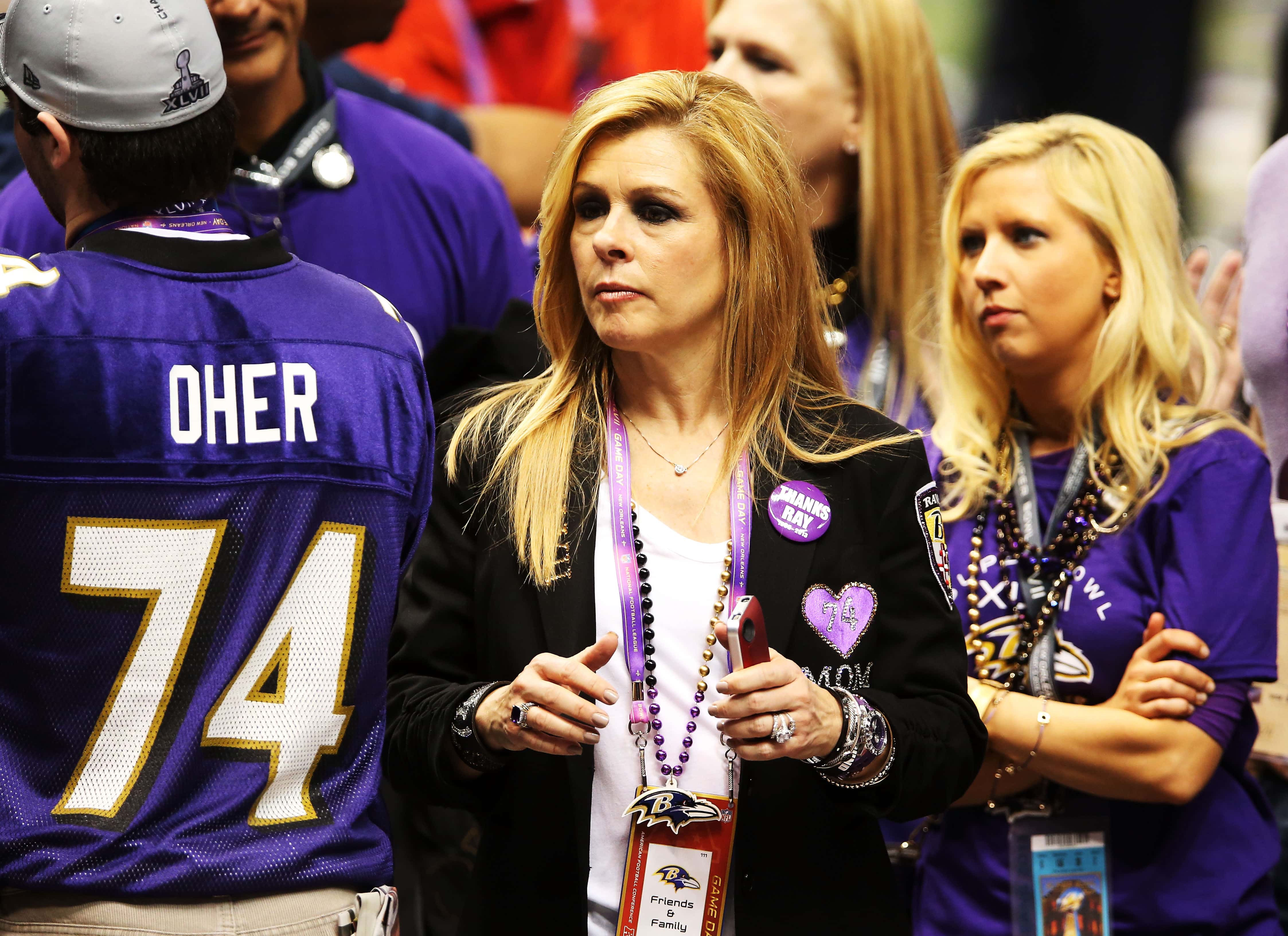 Leigh Anne Tuohy celebrates on the field after her adoptive son Michael Oher #74 of the Baltimore Ravens and the Ravens defeat the San Francisco 49ers 34-31 during Super Bowl XLVII at the Mercedes-Benz Superdome on February 3, 2013 in New Orleans, Louisiana.