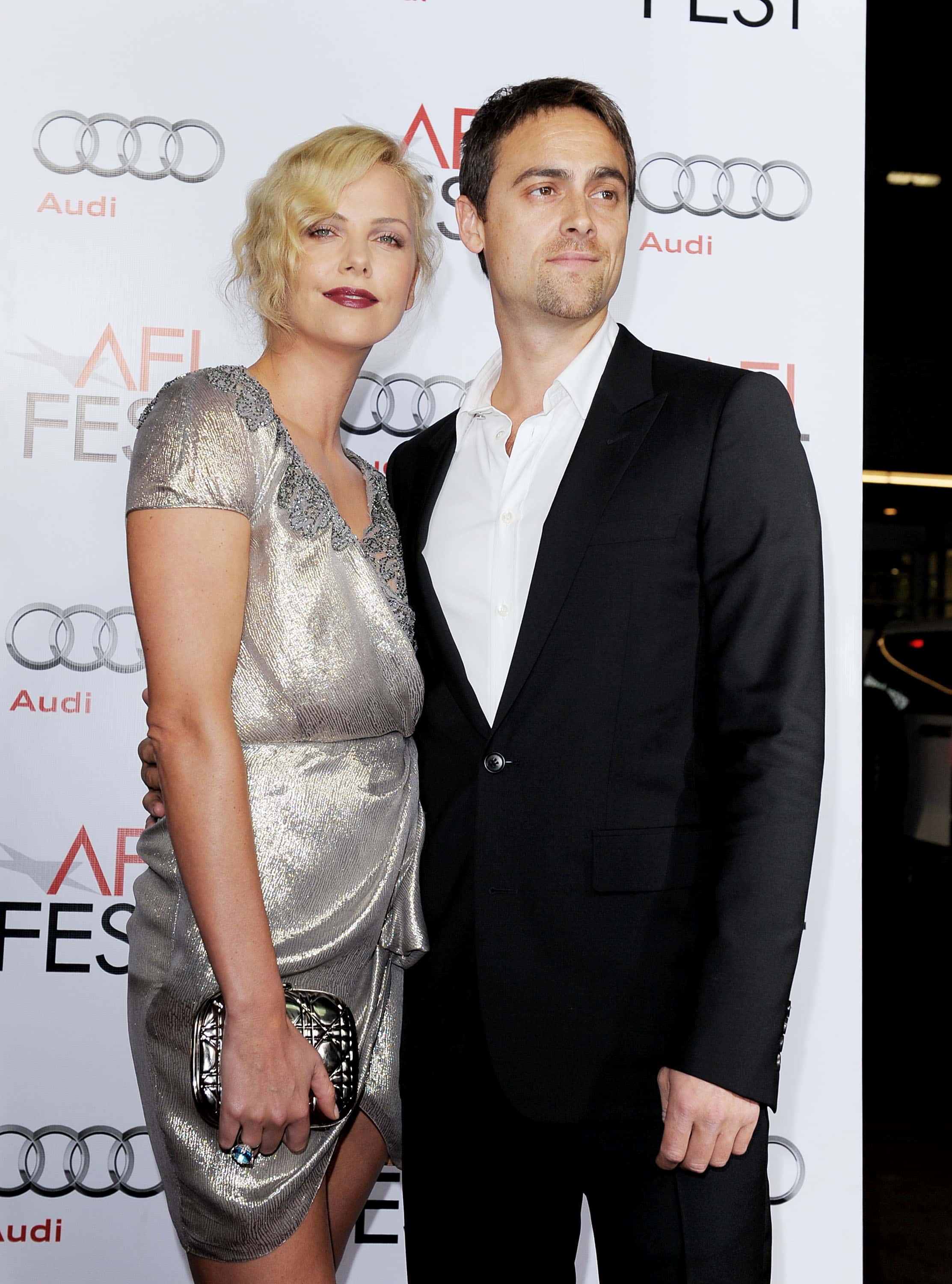 Actress Charlize Theron and boyfriend actor Stuart Townsend arrive at the AFI FEST 2009 screening of