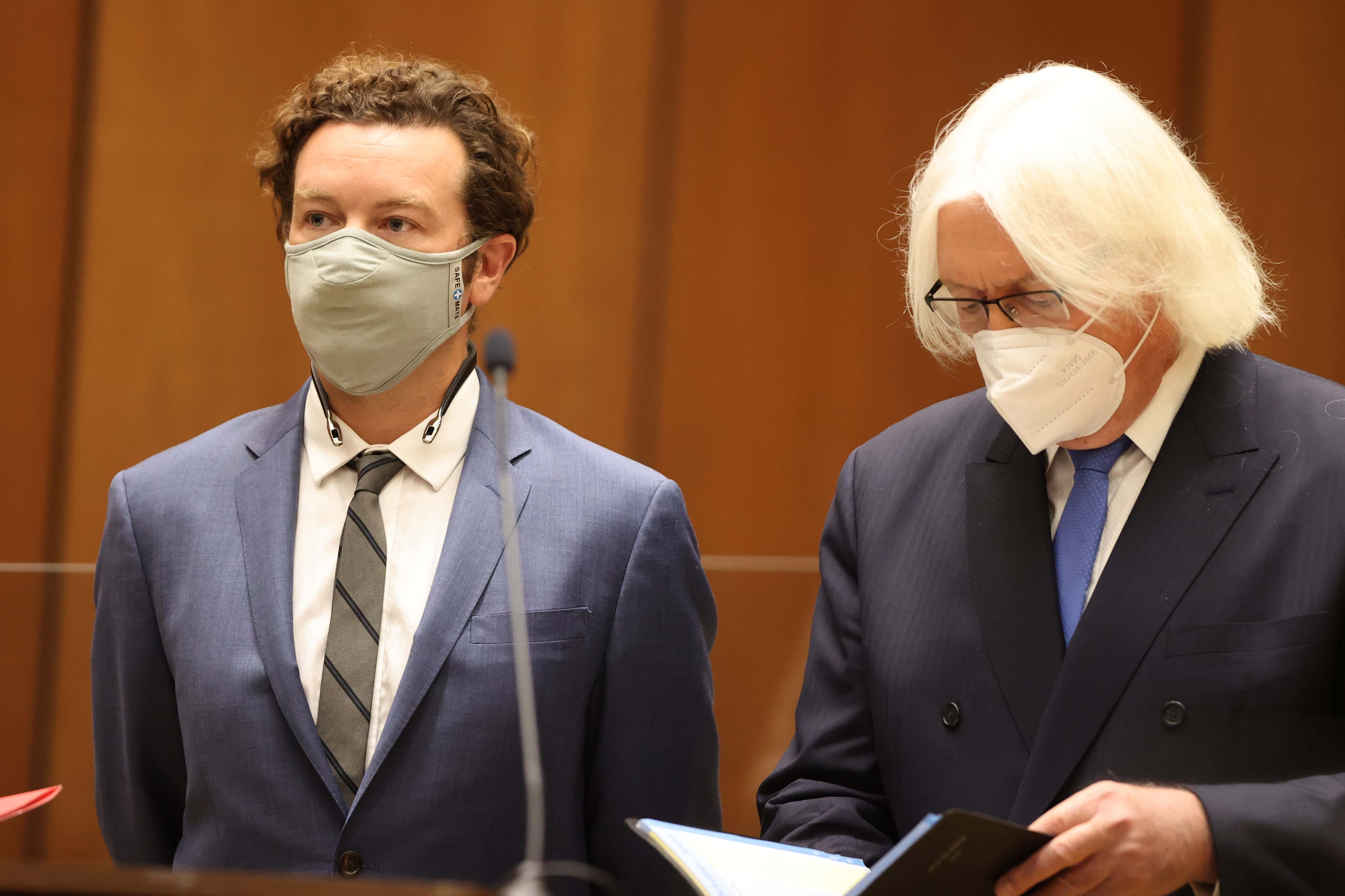Actor Danny Masterson stands with his lawyer Thomas Mesereau as he is arraigned on rape charges at Clara Shortridge Foltz Criminal Justice Center on September 18, 2020, in Los Angeles, California. Masterson has been charged with forcibly raping three women on separate occasions between 2001 and 2003. (Photo by Lucy Nicholson - Pool/Getty Images)