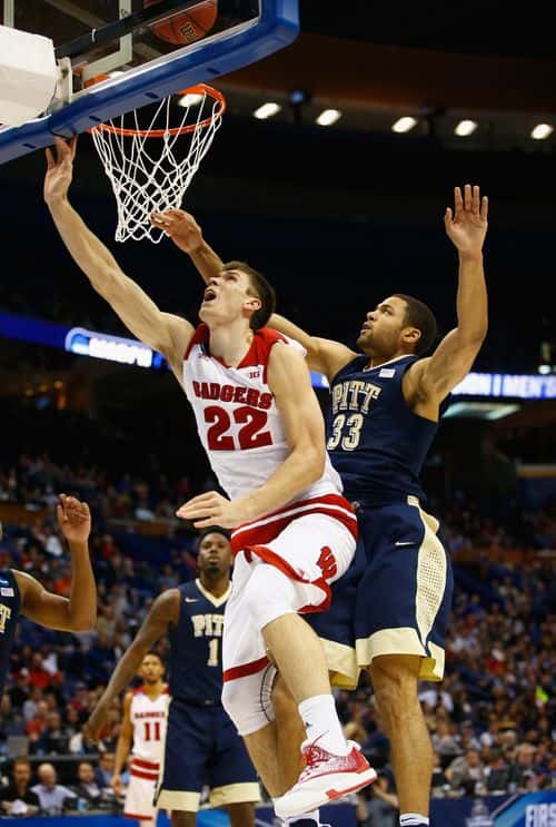 Ethan Happ #22 of the Wisconsin Badgers drives to the basket against Alonzo Nelson-Ododa #33 of the Pittsburgh Panthers in the second half of their game during the first round of the 2016 NCAA Men's Basketball Tournament at Scottrade Center on March 18, 2016 in St Louis, Missouri.