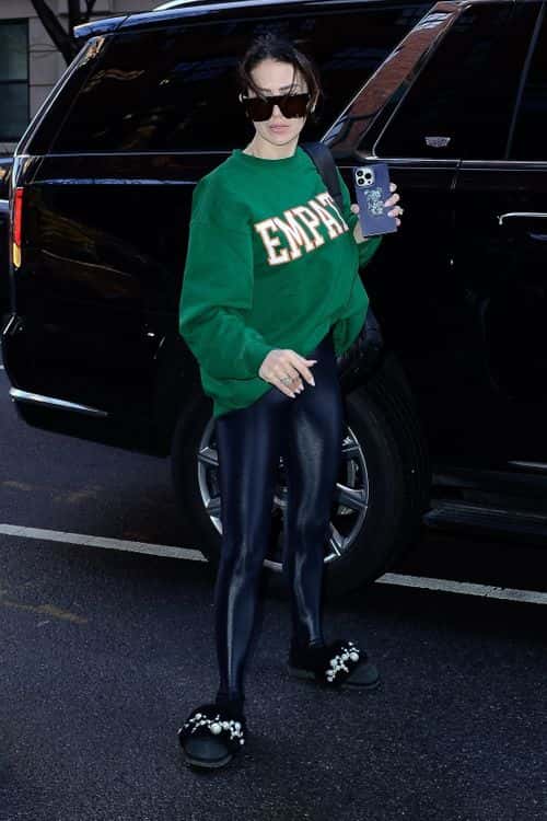 Hilaria Baldwin sports green crewneck sweatshirt with the word 'Empathy' on it one day after husband Alec Baldwin's arrest for manslaughter. (Backgrid)