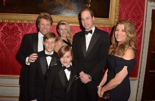 Prince William, Duke of Cambridge meets Jon Bon Jovi (L) and wife Dorothea Hurley (R) and their children Jacob (2L), Stephanie (3L) and Romeo (front, 4L) at Kensington Palace for the Centrepoint Winter Whites Gala on November 26, 2013 in London, England.