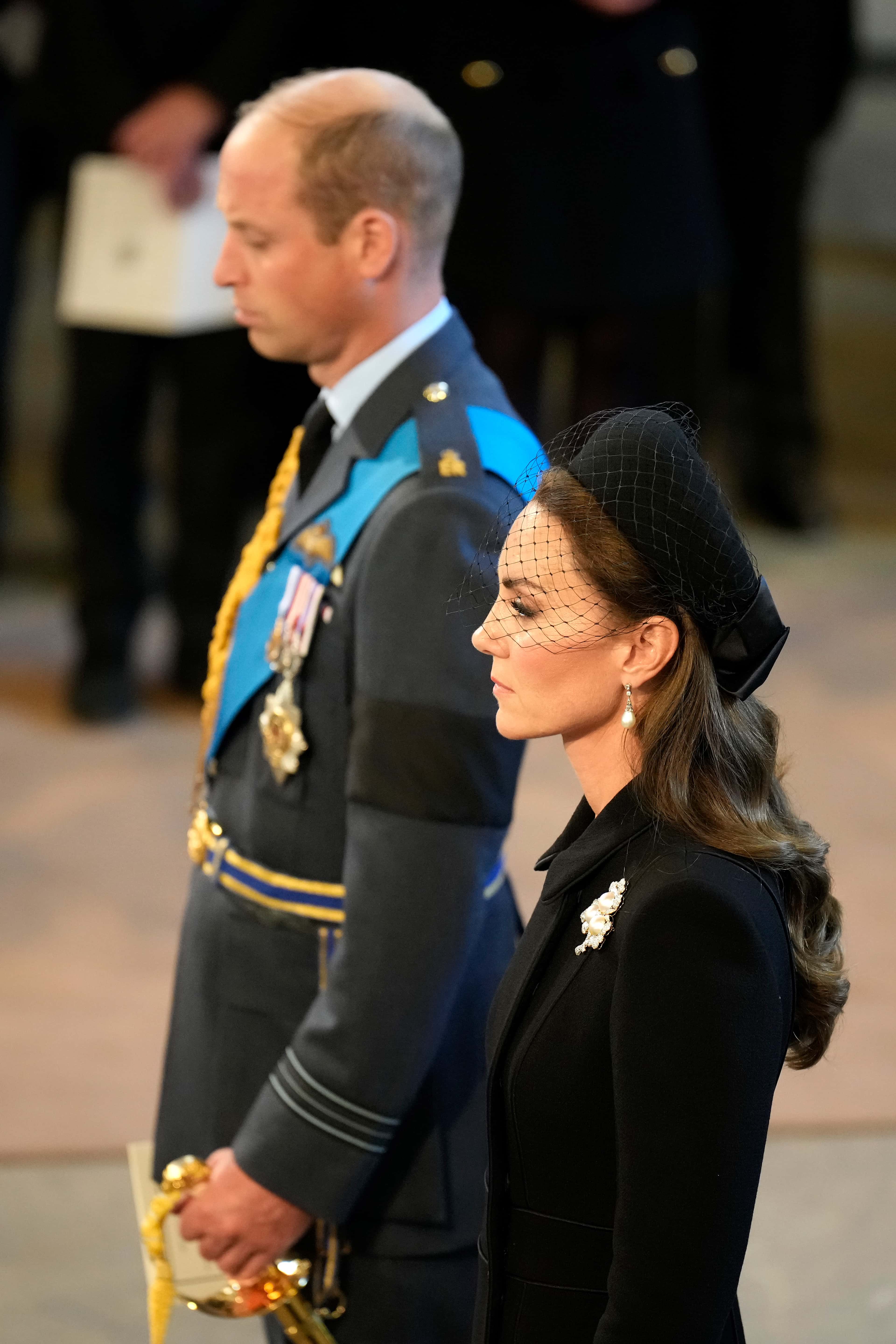 Prince William, Prince of Wales and Catherine, Princess of Wales pay their respects in The Palace of Westminster during the procession for the Lying-in State of Queen Elizabeth II on September 14, 2022 in London, England. Queen Elizabeth II's coffin is taken in procession on a Gun Carriage of The King's Troop Royal Horse Artillery from Buckingham Palace to Westminster Hall where she will lay in state until the early morning of her funeral. Queen Elizabeth II died at Balmoral Castle in Scotland on September 8, 2022, and is succeeded by her eldest son, King Charles III.