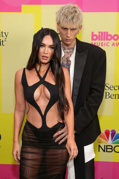 Machine Gun Kelly and Megan Fox poses backstage for the 2021 Billboard Music Awards, broadcast on May 23, 2021 at Microsoft Theater in Los Angeles, California.