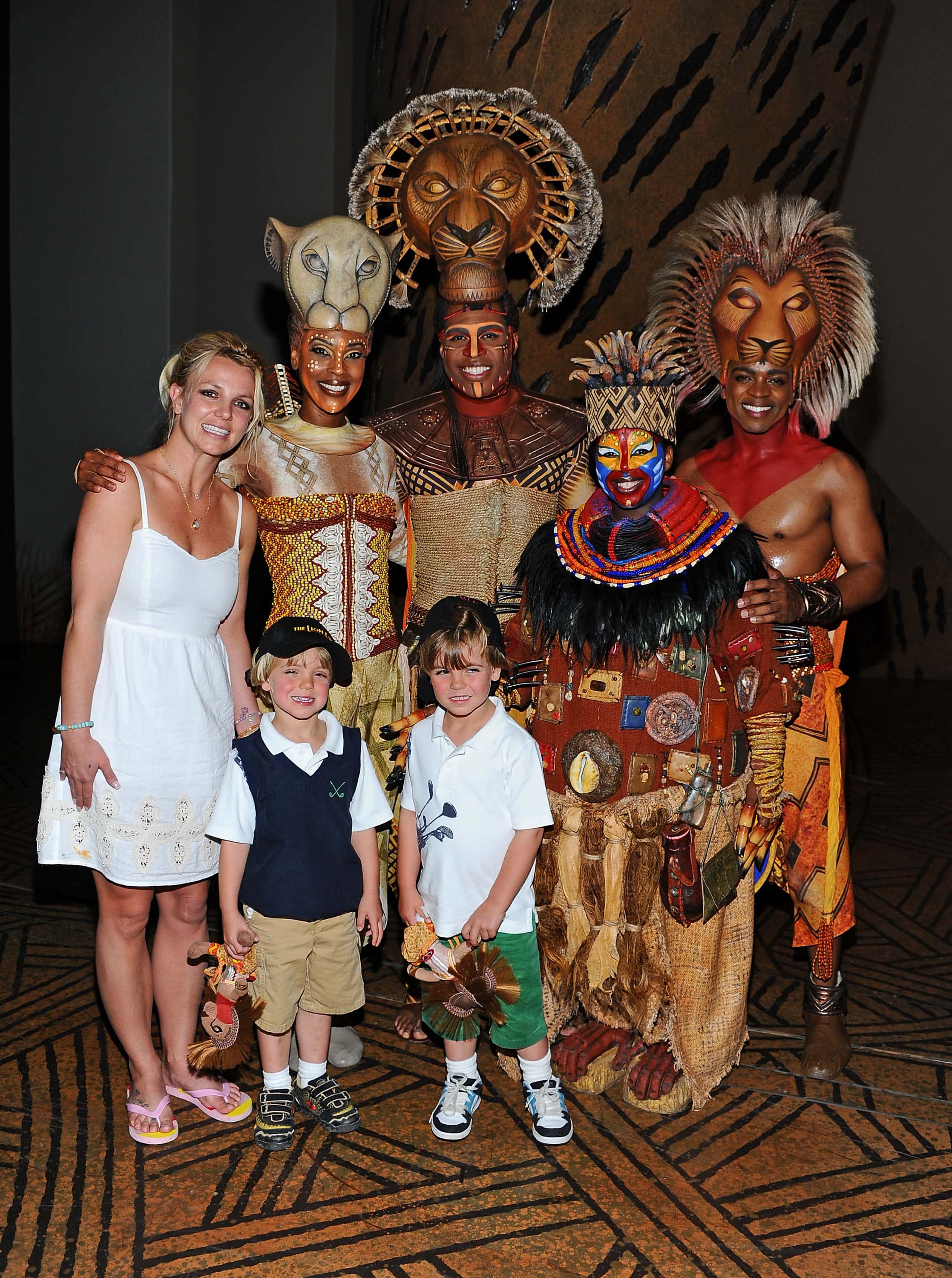 Singer Britney Spears and her sons Jayden James and Sean Preston pose with Kissy Simmons, Derrick Willimas, Ntsepa Pitjeng and Niles Rivers of The Lion King at Mandalay Bay on April 3, 2011 in Las Vegas, Nevada.