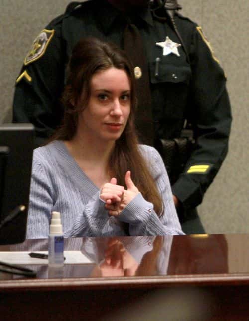 Casey Anthony (L) sits in the courtroom during her sentencing hearing on charges of lying to a law enforcement officer at the Orange County Courthouse July 7, 2011 in Orlando, Florida.  Anthony was acquitted of murder charges on July 5, 2011 but will serve four,  one-year sentences on her conviction of lying to a law enforcement officer. She will be credited for the nearly three-years of time served and good behavior and will reportedly be released in late July or early August.