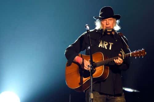 Singer Neil Young performs onstage at the 25th anniversary MusiCares 2015 Person Of The Year Gala honoring Bob Dylan at the Los Angeles Convention Center on February 6, 2015 in Los Angeles, California. The annual benefit raises critical funds for MusiCares' Emergency Financial Assistance and Addiction Recovery programs.