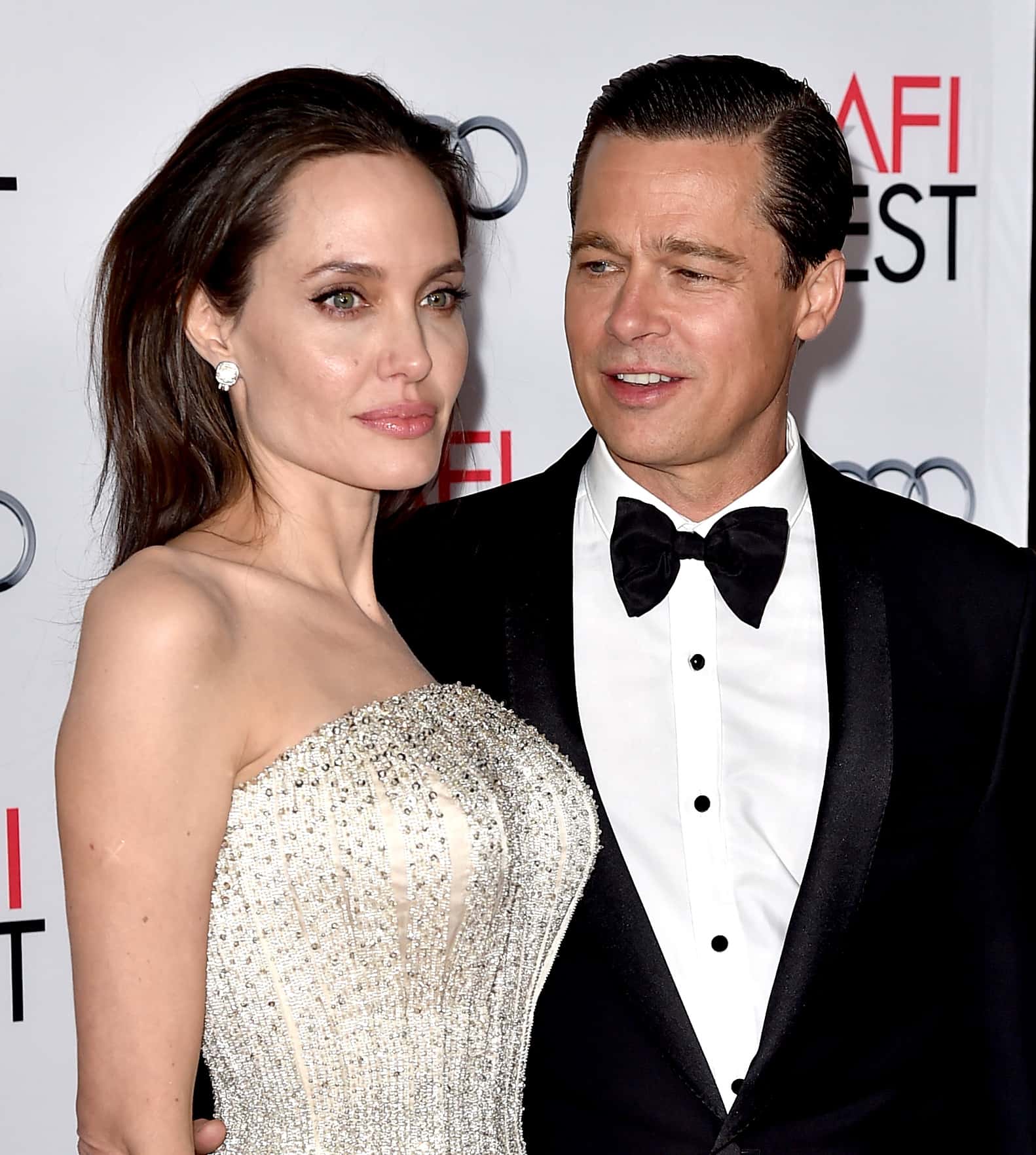 Actress/director Angelina Jolie Pitt (L) and husband actor Brad Pitt arrive at the AFI FEST 2015 presented by Audi opening night gala premiere of Universal Pictures'