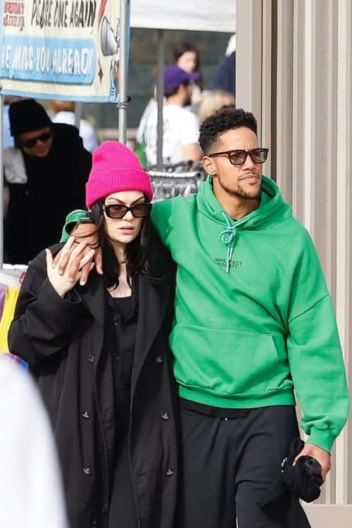 Jessie J covered her baby bump in a black coat as she walks about with boyfriend Chanan Colman. (Photo: Backgrid)