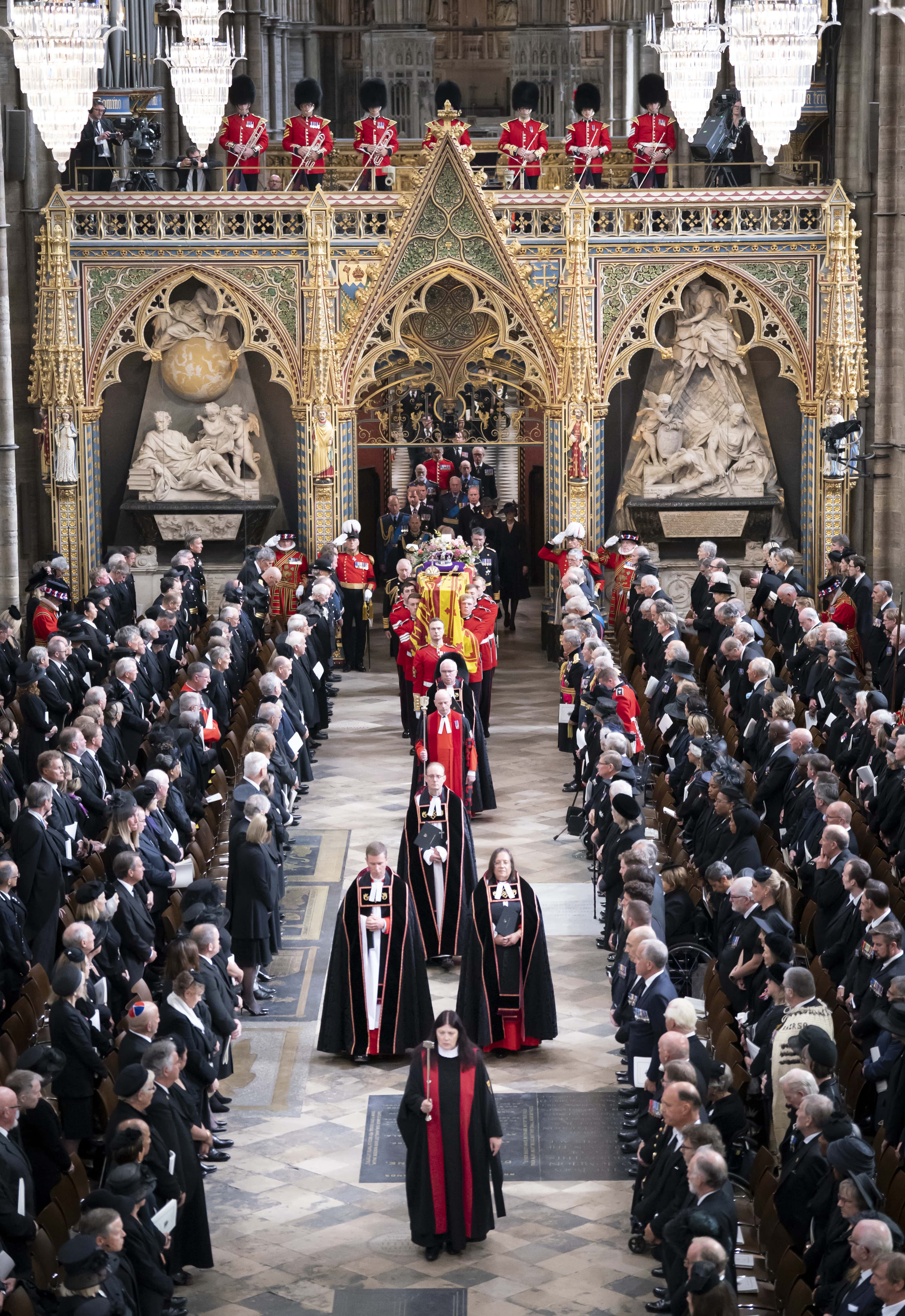 King Charles III follow behind the coffin of Queen Elizabeth II, draped in the Royal Standard with the Imperial State Crown and the Sovereign's orb and sceptre, as it is carried out of Westminster Abbey. after the State Funeral of Queen Elizabeth II at Westminster Abbey on September 19, 2022 in London, England.  Elizabeth Alexandra Mary Windsor was born in Bruton Street, Mayfair, London on 21 April 1926. She married Prince Philip in 1947 and ascended the throne of the United Kingdom and Commonwealth on 6 February 1952 after the death of her Father, King George VI. Queen Elizabeth II died at Balmoral Castle in Scotland on September 8, 2022, and is succeeded by her eldest son, King Charles III.