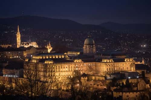 Buda Castle is seem on January 17, 2019 in Budapest, Hungary. The Parliament building has become a site of growing protests over the past months. Over the past months thousands of Hungarians have turned out in the streets to call for the resignation of Prime Minister Viktor Orban. Orban was reelected for a third term in April 2018, since taking office Orban, has rebranded his ruling party Fidesz, once a liberal youth party, as a right-wing Christian nationalist organization. After the party’s victory in 2010, Orban moved to remake Hungary as what he termed “an illiberal state.” Since then, Orban has introduced many changes and new laws to realize this vision: the court system has been stacked with government loyalists; Orban’s allies have taken control of most Hungarian media; a new labor law - dubbed the “slave law” by critics - has increased the limit on overtime from 250hrs to 400hrs per year; the “Stop Soros” bill targeted NGOs and individuals assisting refugees and migrants; accreditation laws for foreign universities were changed, forcing the renowned Central European University to move most operations to Vienna; and a new homeless law that criminalizes sleeping on the streets. Mr. Orban’s moves have created a template for his brand of illiberal democracy, which is providing inspiration to far-right and populist leaders in Poland, Italy, France, Netherlands and Brazil.