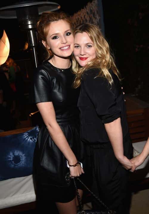 Actress Bella Thorne and hostess/actress Drew Barrymore (R) attend Refinery29 Los Angeles Holiday Party Hosted By R29 Editor-At-Large Drew Barrymore at Sunset Tower on December 10, 2014 in West Hollywood, California.