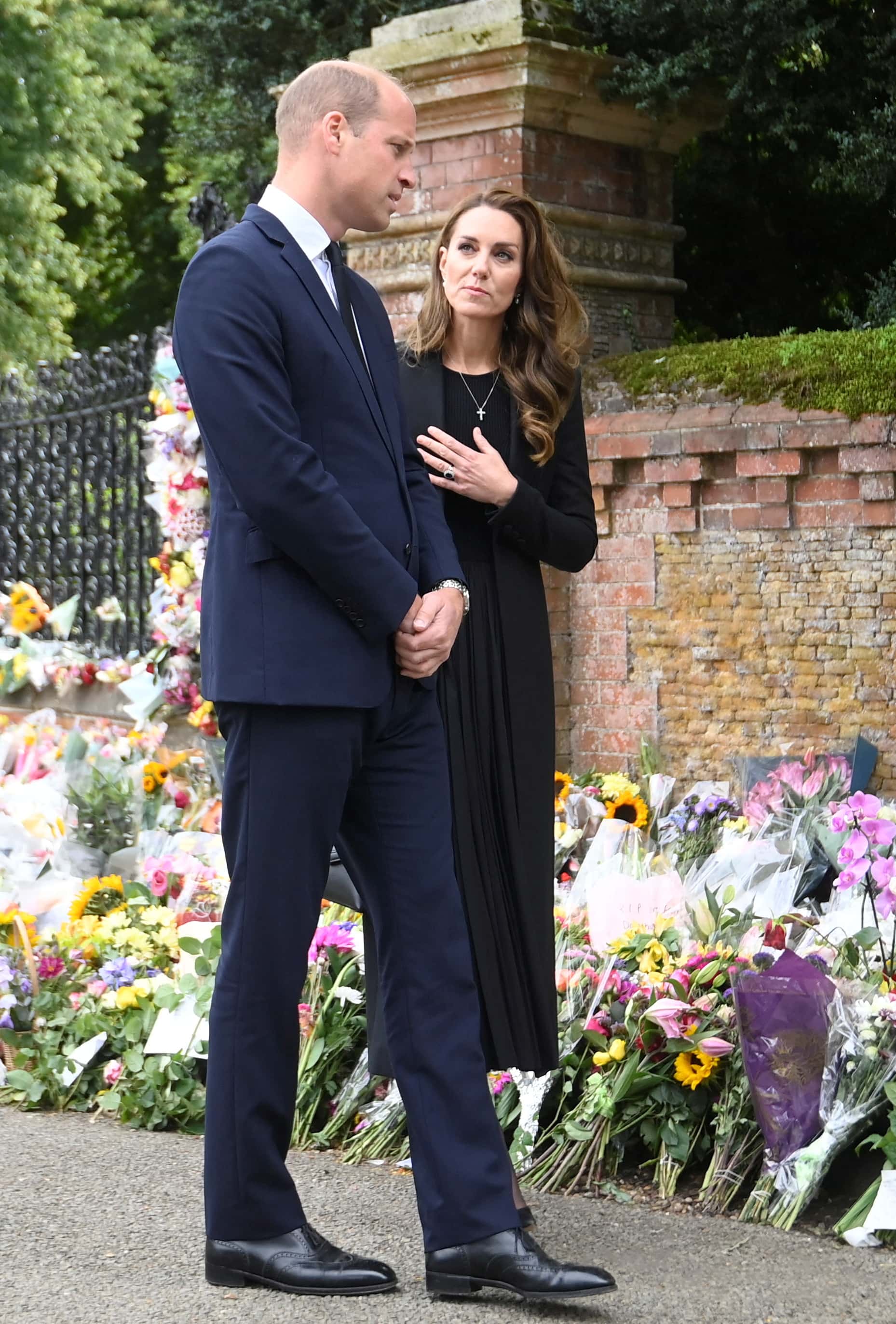 Prince William, Prince of Wales and Catherine, Princess of Wales, view floral tributes placed outside the Sandringham Estate following the death of Queen Elizabeth II, on September 15, 2022 in King's Lynn, England. The Prince and Princess of Wales are visiting Sandringham to view tributes to Queen Elizabeth II, who died at Balmoral Castle on September 8, 2022.