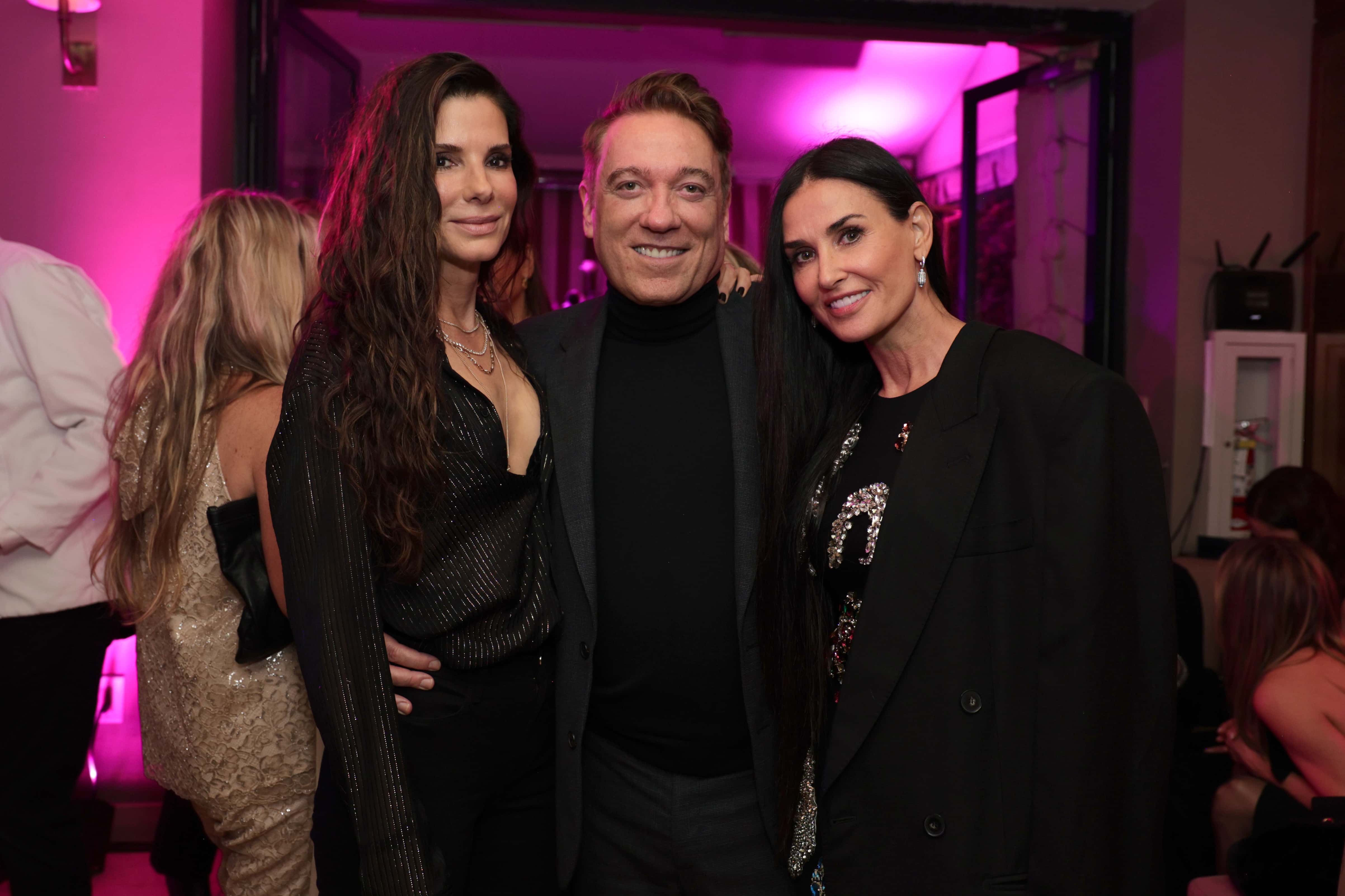 (L-R) Sandra Bullock, Kevin Huvane, and Demi Moore attend the The CAA Pre-Oscar Party at Sunset Tower Hotel on March 10, 2023 in Los Angeles, California.