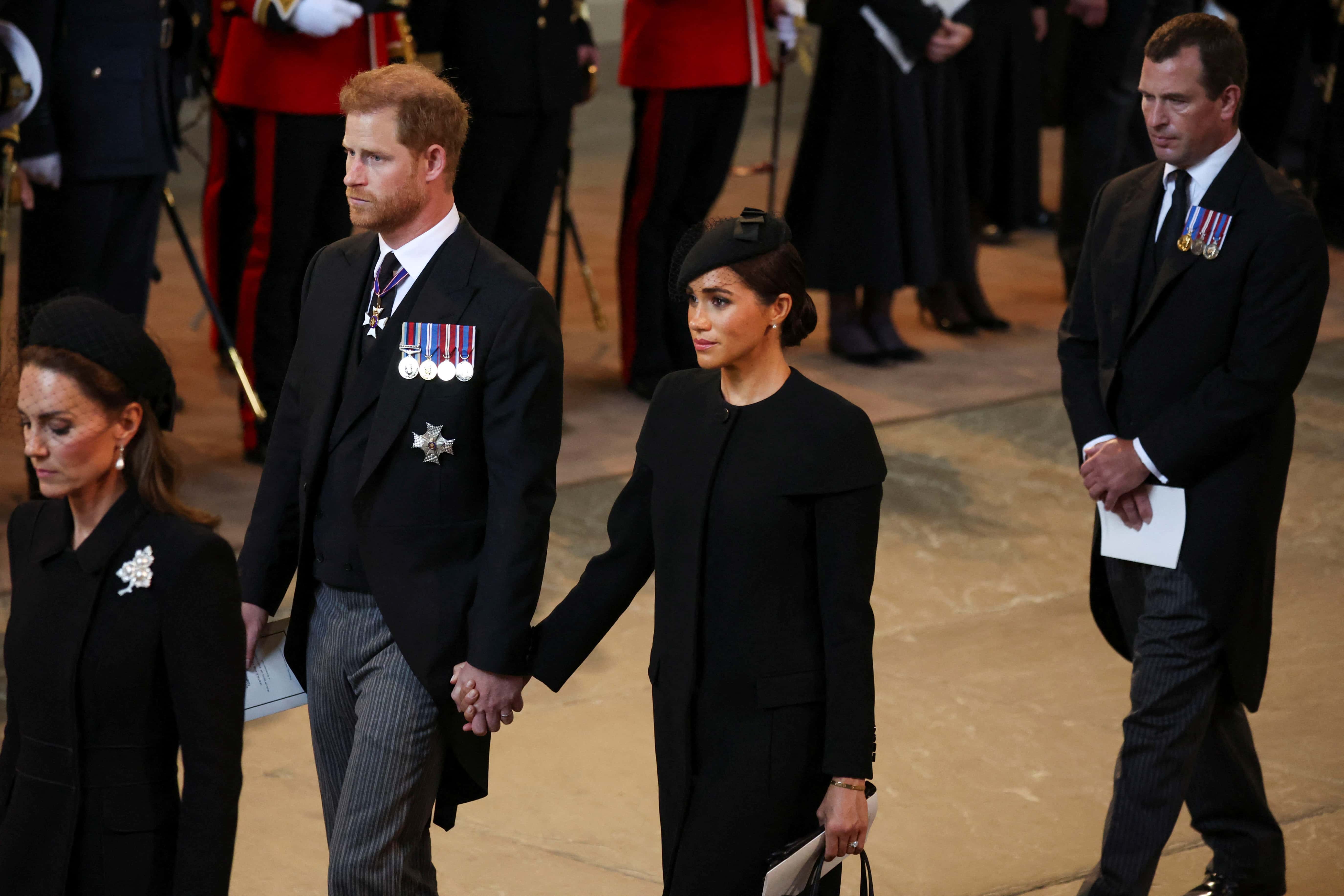 Catherine, Princess of Wales, Prince Harry, Duke of Sussex and Meghan, Duchess of Sussex and Peter Phillips arrive in the Palace of Westminster after the procession for the Lying-in State of Queen Elizabeth II on September 14, 2022 in London, England. Queen Elizabeth II's coffin is taken in procession on a Gun Carriage of The King's Troop Royal Horse Artillery from Buckingham Palace to Westminster Hall where she will lay in state until the early morning of her funeral. Queen Elizabeth II died at Balmoral Castle in Scotland on September 8, 2022, and is succeeded by her eldest son, King Charles III.