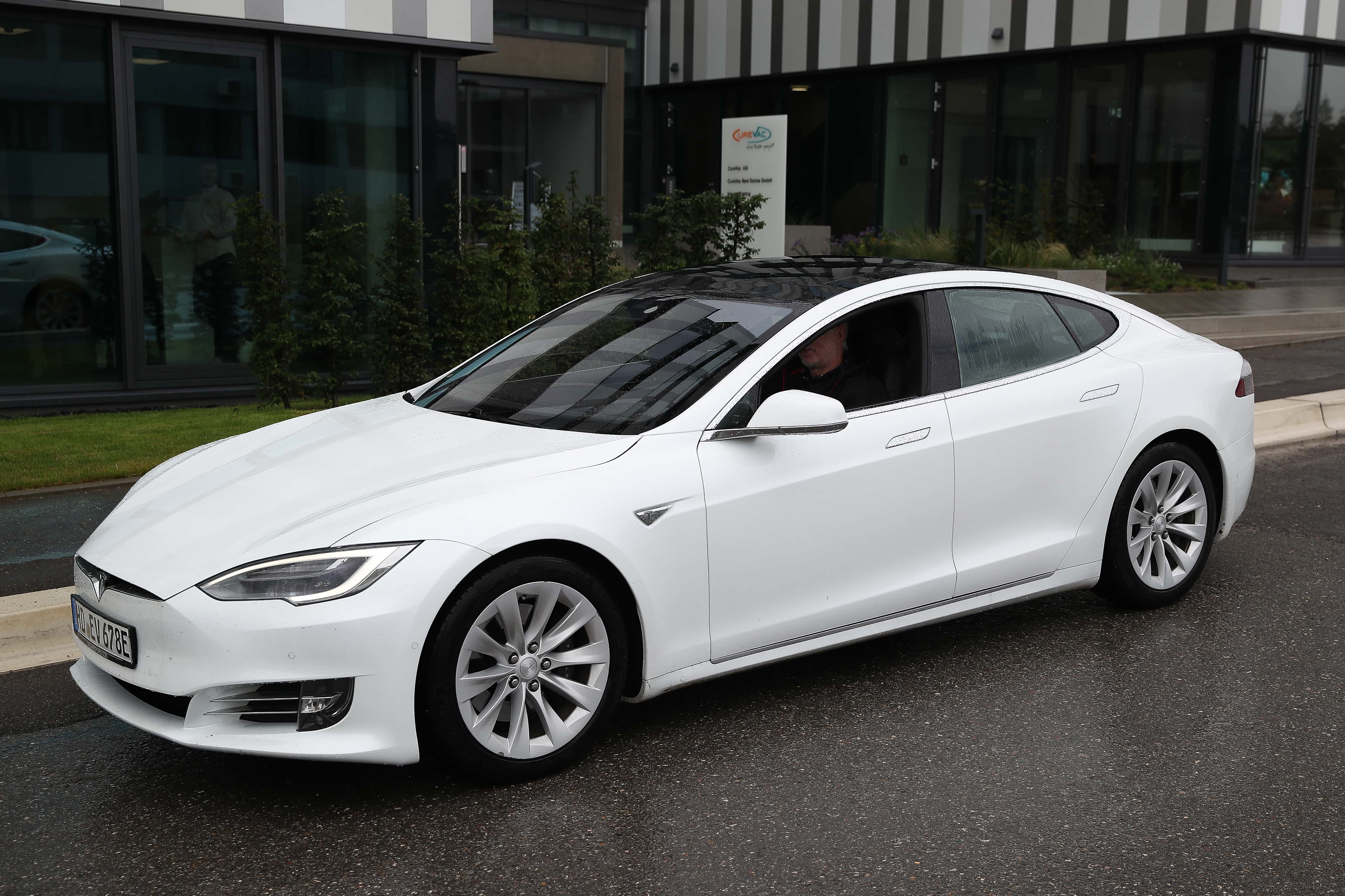 A Tesla car drives past the building home to German vaccine maker CureVac on September 1, 2020 in Tubingen, Germany. Tesla head Elon Musk announced on Twitter that he is traveling to Germany and plans to visit both CureVac, with which Tesla has a cooperation to build devices for producing RNA vaccines, and the site of the new Gigafactory under construction near Berlin this week.
