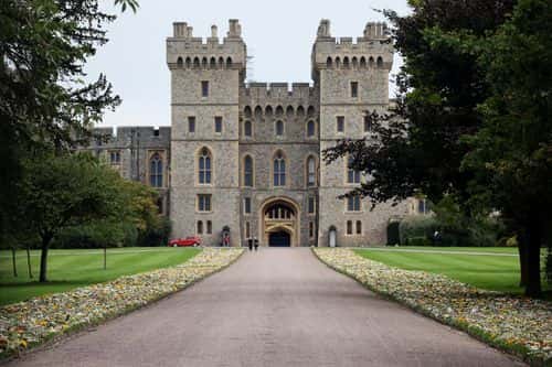 Flower tributes are moved to the grounds within the gates on The Long Walk, in front of Windsor Castle on September 13, 2022 in Windsor, England. Elizabeth Alexandra Mary Windsor was born in Bruton Street, Mayfair, London on 21 April 1926. She married Prince Philip in 1947 and acceded to the throne of the United Kingdom and Commonwealth on 6 February 1952 after the death of her Father, King George VI. Queen Elizabeth II died at Balmoral Castle in Scotland on September 8, 2022, and is succeeded by her eldest son, King Charles III.