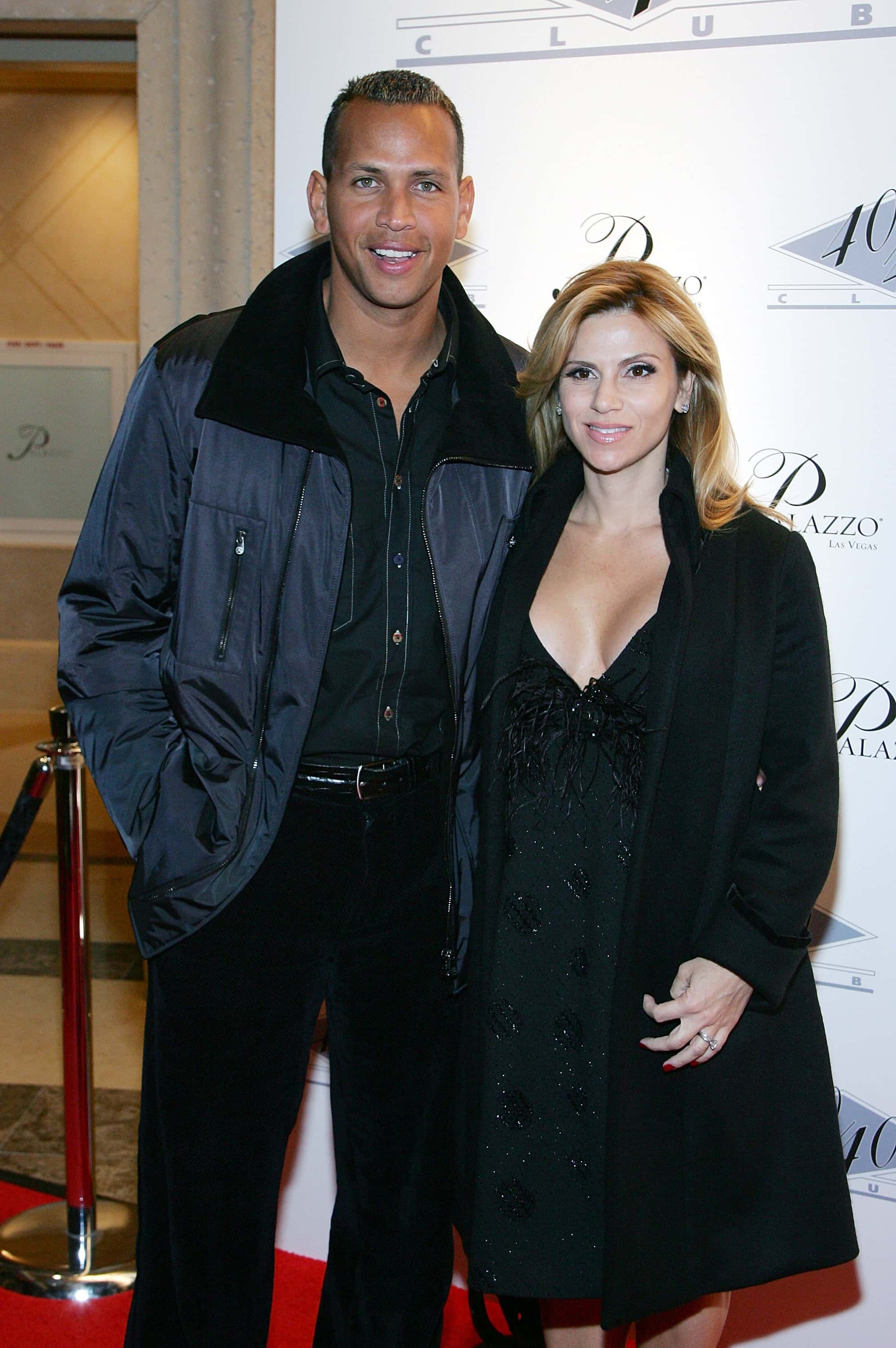 Alex Rodriguez (L) of the New York Yankees and his wife Cynthia Scurtis arrive at the opening of Jay-Z's USD 20 million 40/40 Club, a 24,000-square-foot sports bar and lounge at The Palazzo Resort-Hotel-Casino December 30, 2007 in Las Vegas, Nevada.