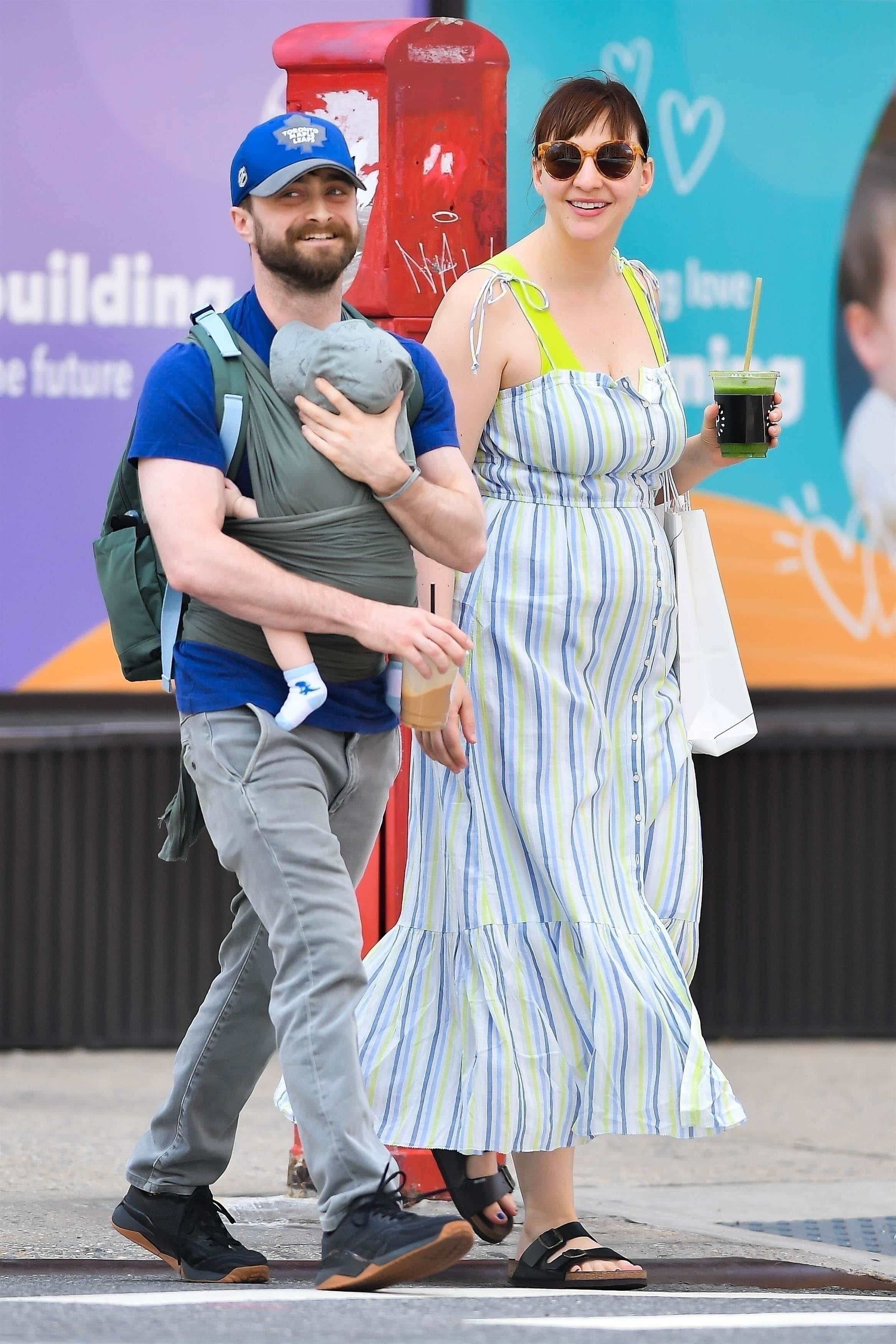 Daniel, 33, looked full of happiness in the exclusive snaps as he walked along beside his partner and new mum Erin, 38 (Backgrid)