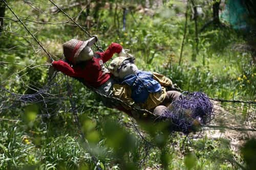 Hand-made dolls swing in a hammock as others are placed around the village by local resident Tsukimi Ayano to replace the dwindling local population on April 22, 2016 in Nagoro village, in Miyoshi, Japan. Likely more dolls than the number of inhabitants are placed around the village called