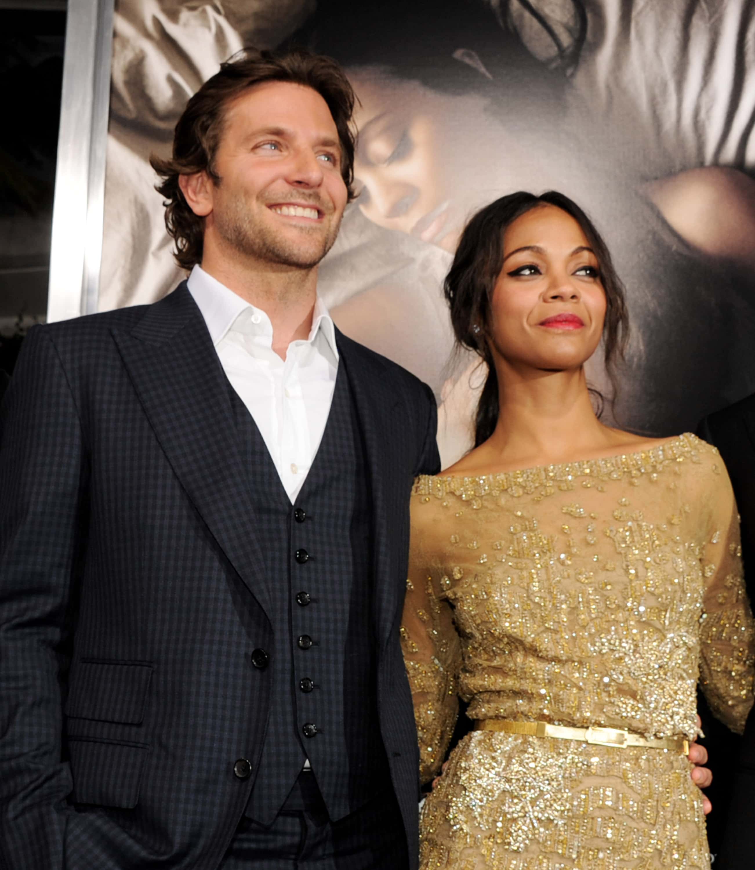 Actors Bradley Cooper (L) and Zoe Saldana arrive at the premiere of CBS Films'