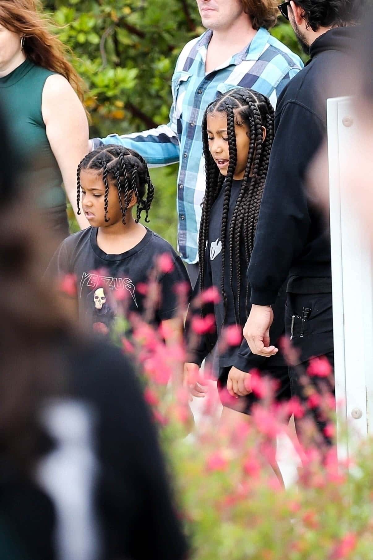 North, nine, and Saint, seven, stayed close together as they took part in the event in Los Angeles (Backgrid)
