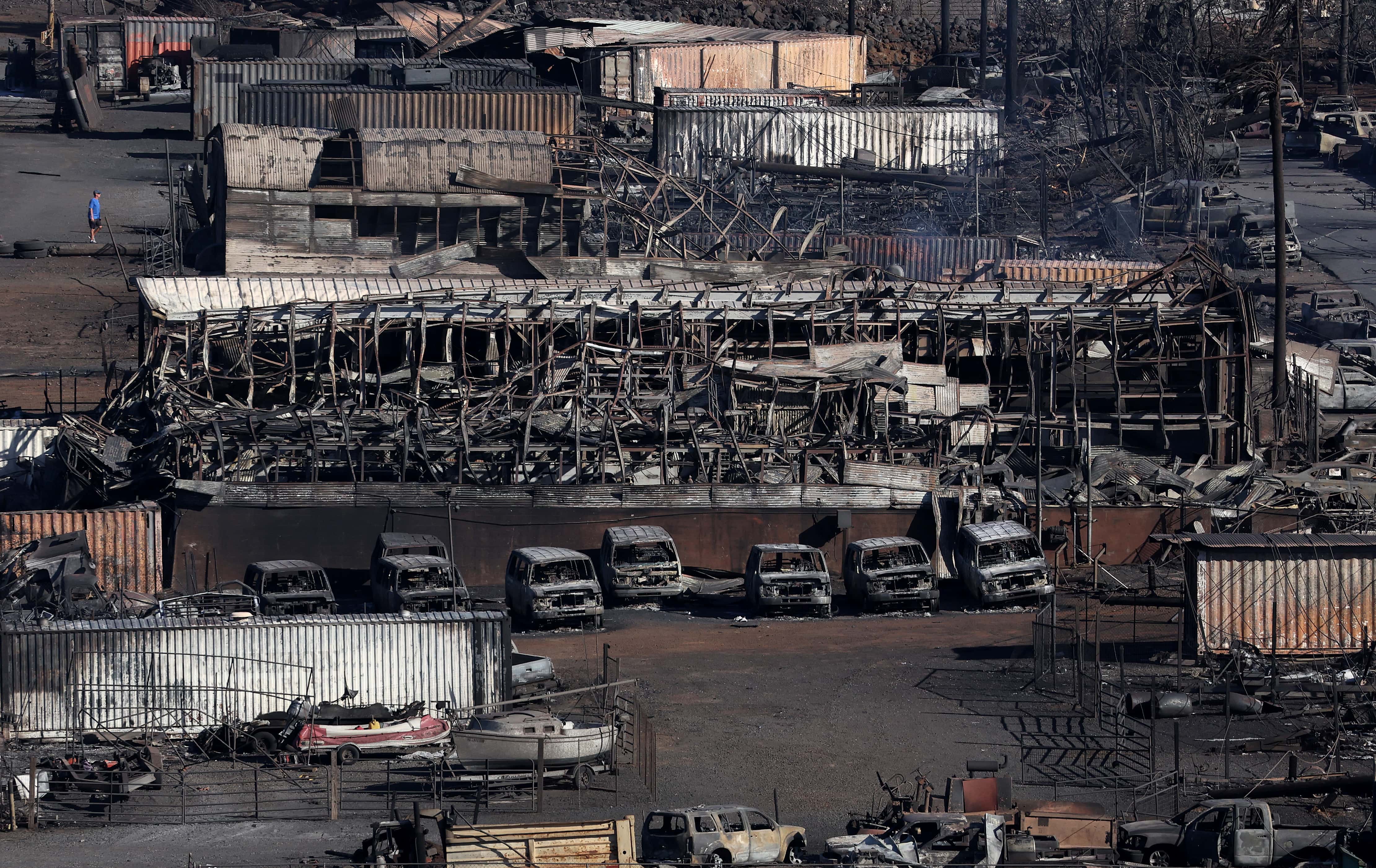 LAHAINA, HAWAII - AUGUST 11: In an aerial view, a looks at a business that was destroyed by a wildfire on August 11, 2023 in Lahaina, Hawaii. Dozens of people were killed and thousands were displaced after a wind-driven wildfire devastated the town of Lahaina on Tuesday. Crews are continuing to search for missing people. (Photo by Justin Sullivan/Getty Images)