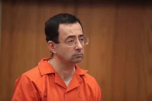 Larry Nassar stands as he is sentenced by Judge Janice Cunningham for three counts of criminal sexual assault in Eaton County Circuit Court on February 5, 2018 in Charlotte, Michigan. Nassar has been accused of sexually assaulting more than 150 girls and young women while he was a physician for USA Gymnastics and Michigan State University. Cunningham sentenced Nassar to 40 to 125 years in prison. He is currently serving a 60-year sentence in federal prison for possession of child pornography. Last month a judge in Ingham County, Michigan sentenced Nassar to an 40 to 175 years in prison after he plead guilty to sexually assaulting seven girls.
