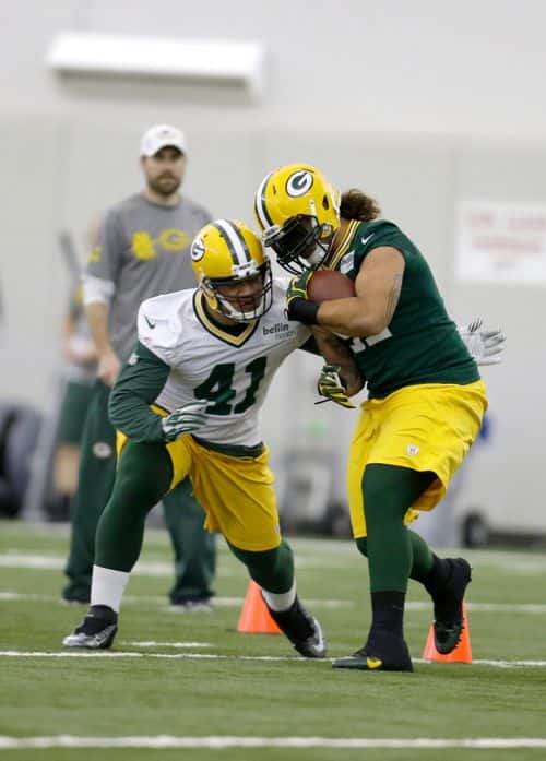 Cole Klutz #41(left) of the Green Bay Packers and Carl Bradford #91 run through some drills during rookie mini camp at Don Hudson Center on May 16, 2014 in Green Bay, Wisconsin.